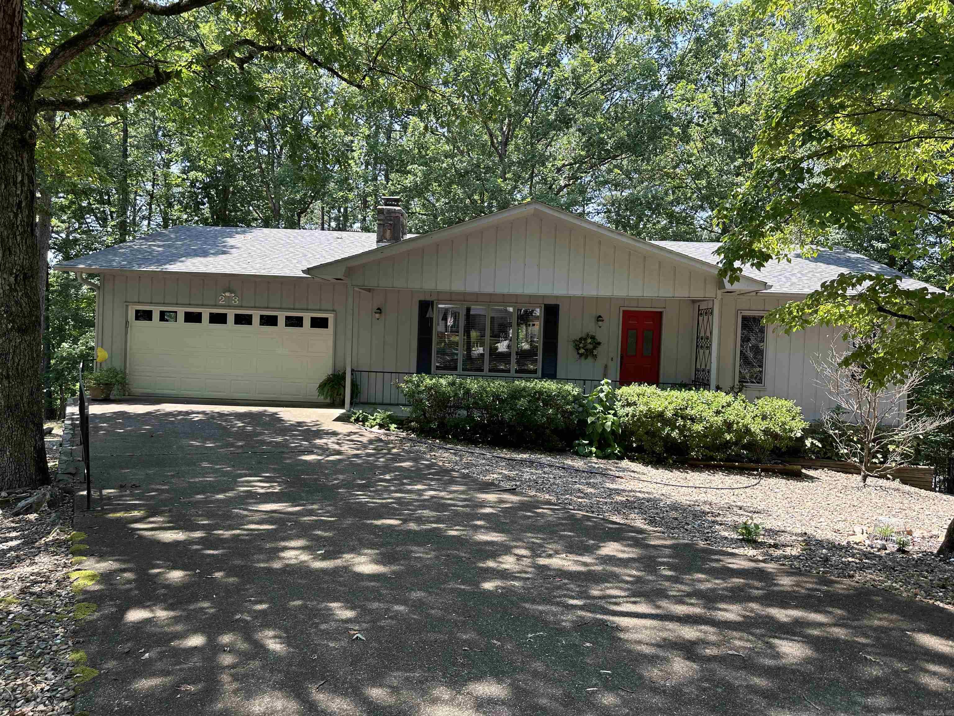 Near everything the neighborhood has to offer this beautiful home is on a quiet cul-de-sac street with common property joining the back of lot. The gravel yard ensures a low maintenance lot with plenty of mature foliage. The home is well maintained and move in ready with an updated kitchen, beautiful rock wood burning fireplace to welcome you as you enter the home with hardwood floors throughout living and dining area. Enjoy your morning coffee lounging in the sunroom with a panoramic view of a mature oak forests. The sunroom is not included in the square footage of home. The basement has a workshop area. The refrigerator, cookstove, washer and dryer all covey with property. Improvements include Roof replaced in 2021, New gutters with covers added 2018, Water heater replaced 2021, new dehumidifier 2022. Heat pump and crawlspace routinely inspected twice a year. (Agents See Remarks)