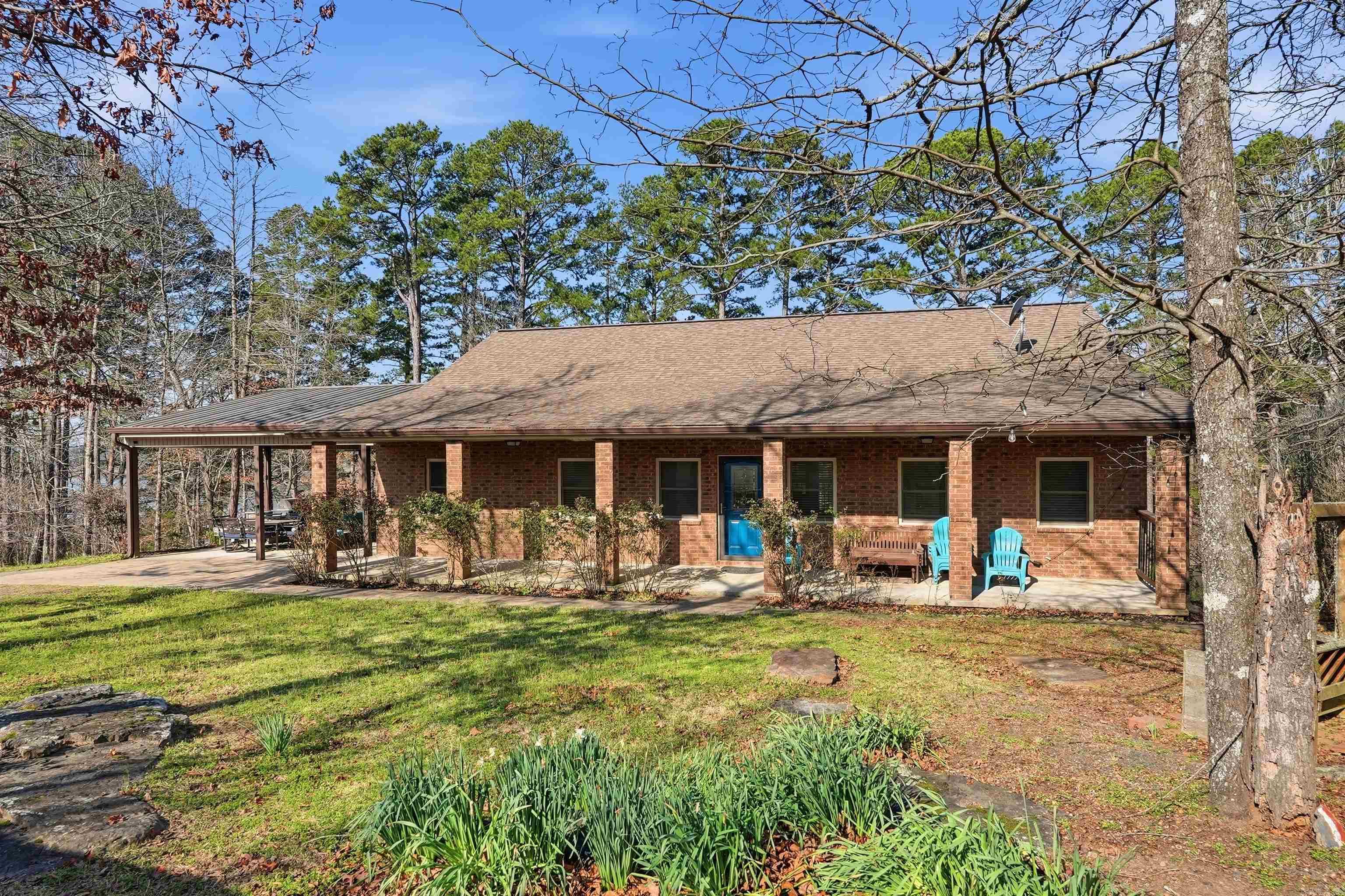 Lakefront Living on Greers Ferry Lake + Boat Slip + Game Room - Move in Ready!!! Remodeled lakefront beauty with a boat slip! This spacious home offers open living areas, modern updates and unbeatable water access. Enjoy a fully finished basement built for fun, complete with a pool table, air hockey, dartboard and cornhole on the lower patio. 30 x 30 garage/shop! Finished out basement includes two bunk rooms! Whole home water filtration sytem. Perfect for entertaining and relaxing, with room for everyone and everything you love about lake life.