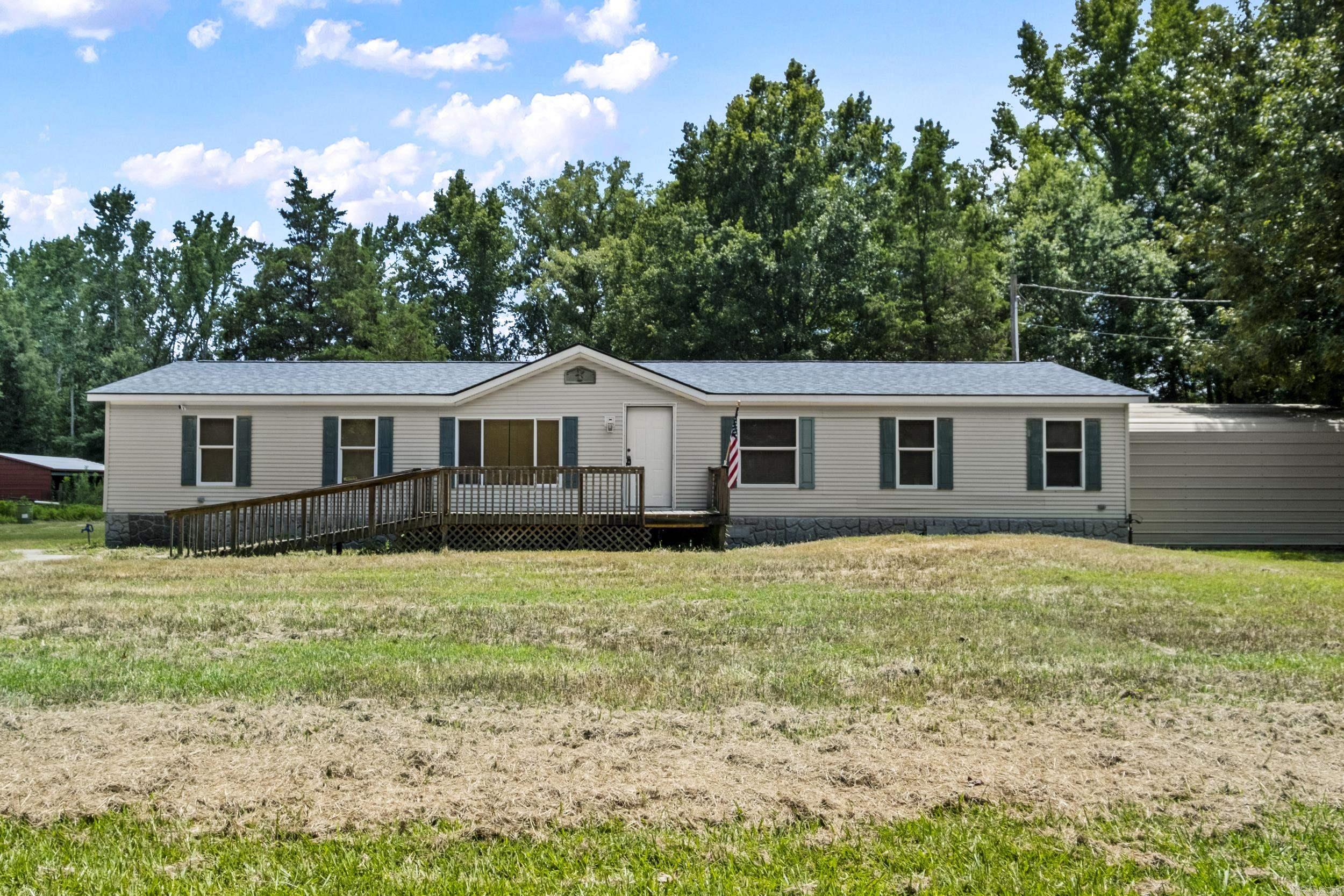 Enjoy the peace and quiet of country living on 4 acres with plenty of room for horses, animals, gardening, or outdoor activities. This 3-bedroom, 2-bath home features stainless steel appliances, a garden tub in the primary bath, and large closets in each bedroom. Relax on the front and back decks while taking in the country setting. The property also includes a 3-stall horse barn and two storage sheds, offering ample space for equipment, feed, or hobbies. If you're looking for an affordable country property with acreage and room to make it your own, this one is worth a look. Schedule your showing today! Agents see remarks!