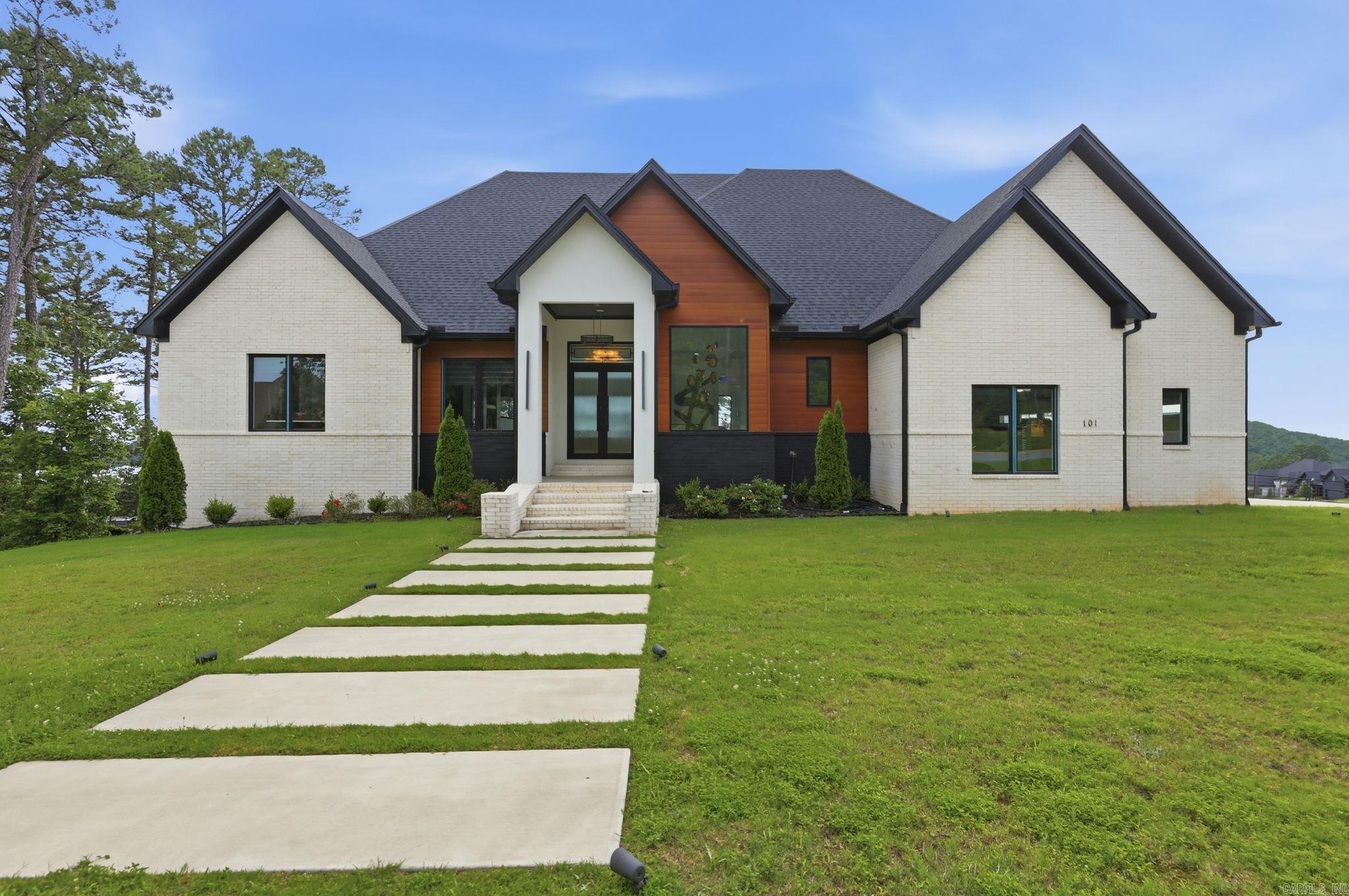 101 Falstone Drive is a statement piece in one of West Little Rock's most sought after locations. This 4500 SF home built in 2024 checks every box. From the architecture and finishes to the entertaining spaces and overall functionality every detail has been thoughtfully curated to deliver a true luxury living experience. Each bedroom has en-suite baths with custom designed walk in closets. Beautiful Mountain views with expansive outdoor living areas. Extras come in three's: 3 fireplaces, 3 living areas including a bar and gaming room,  3 car garage, and 3 private balconies. Wanting to add a pool? This backyard is perfect! Call listing agent to see it today!