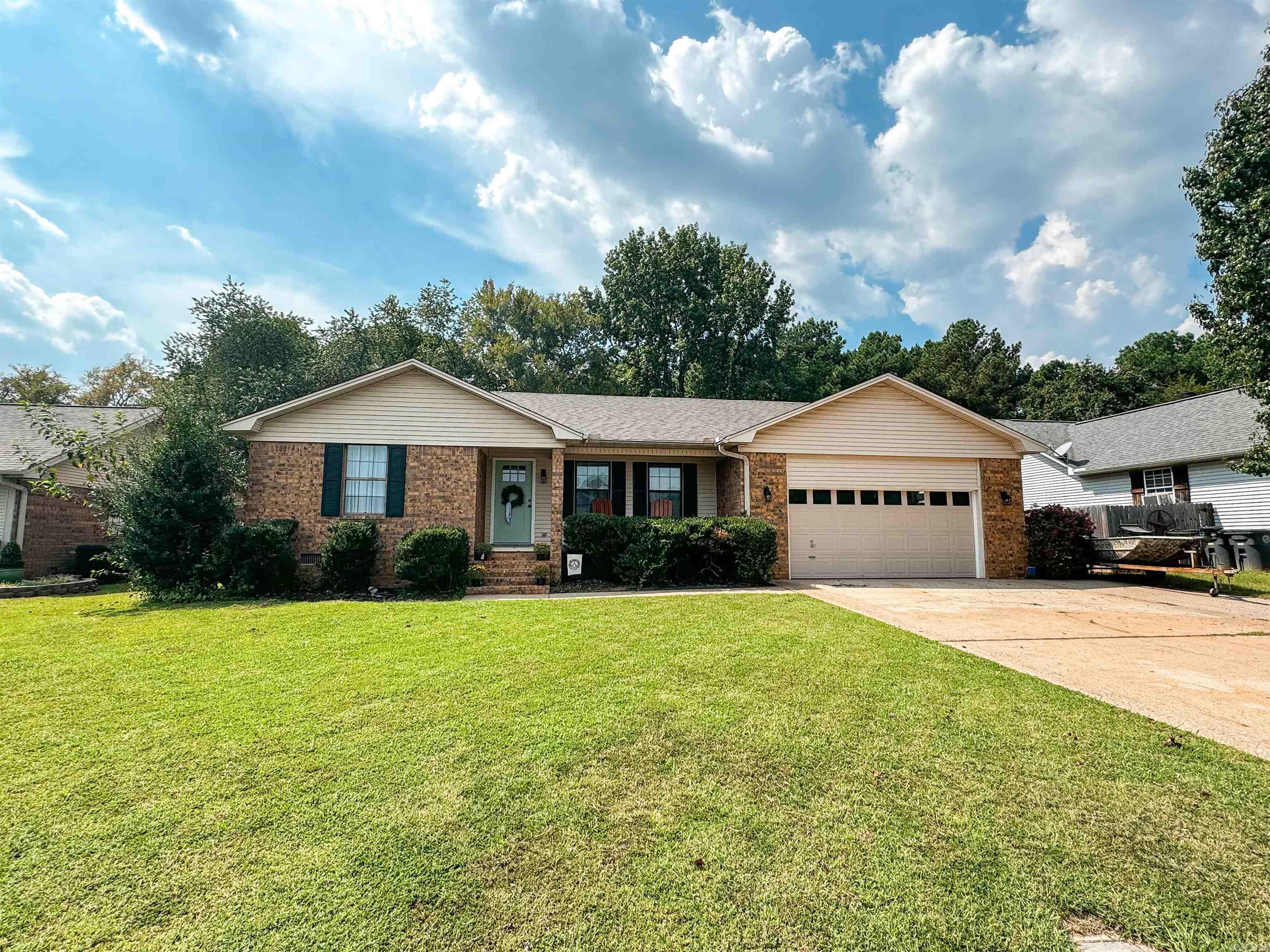 Lovely 3 Bedroom/2 full baths with half bath off laundry room. This home has had some amazing updates including a total kitchen remodel, countertops, laminate flooring, paint, some windows, newer oven, microwave, toilets, ceiling fans & more.  There is a spacious sunroom that runs along the back of the house that can be used as a second living area, office or playroom. The living room is very roomy with vaulted ceilings and extra lighting. Roof was replaced 7/24 & HVAC is newer as well. Other features include a 2 car garage, quartz countertops, pantry & breakfast bar, patio & fenced backyard. Call today to get a tour of this beautiful home! Agents see remarks for updates!