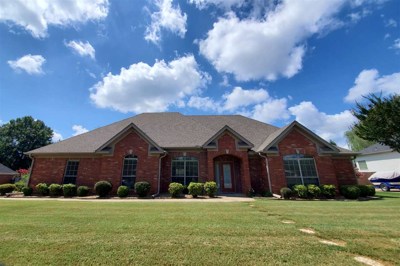 Your search is over! This is the house you've been looking for! Well maintained 4 bedroom 2 bathroom homes tucked away in the Woodlands Park subdivision. Brick and Stone Exterior, Vaulted Ceilings, Fireplace Granite counter-tops, whirlpool tub, walk-in closets & built-in shelving. This one checks off all the big boxes! The backyard is huge, added privacy of a side entry, 2 car garage with a storage room. You just have to come see it yourself! Motivated seller! Smoke/Pet free home. Exclusions.