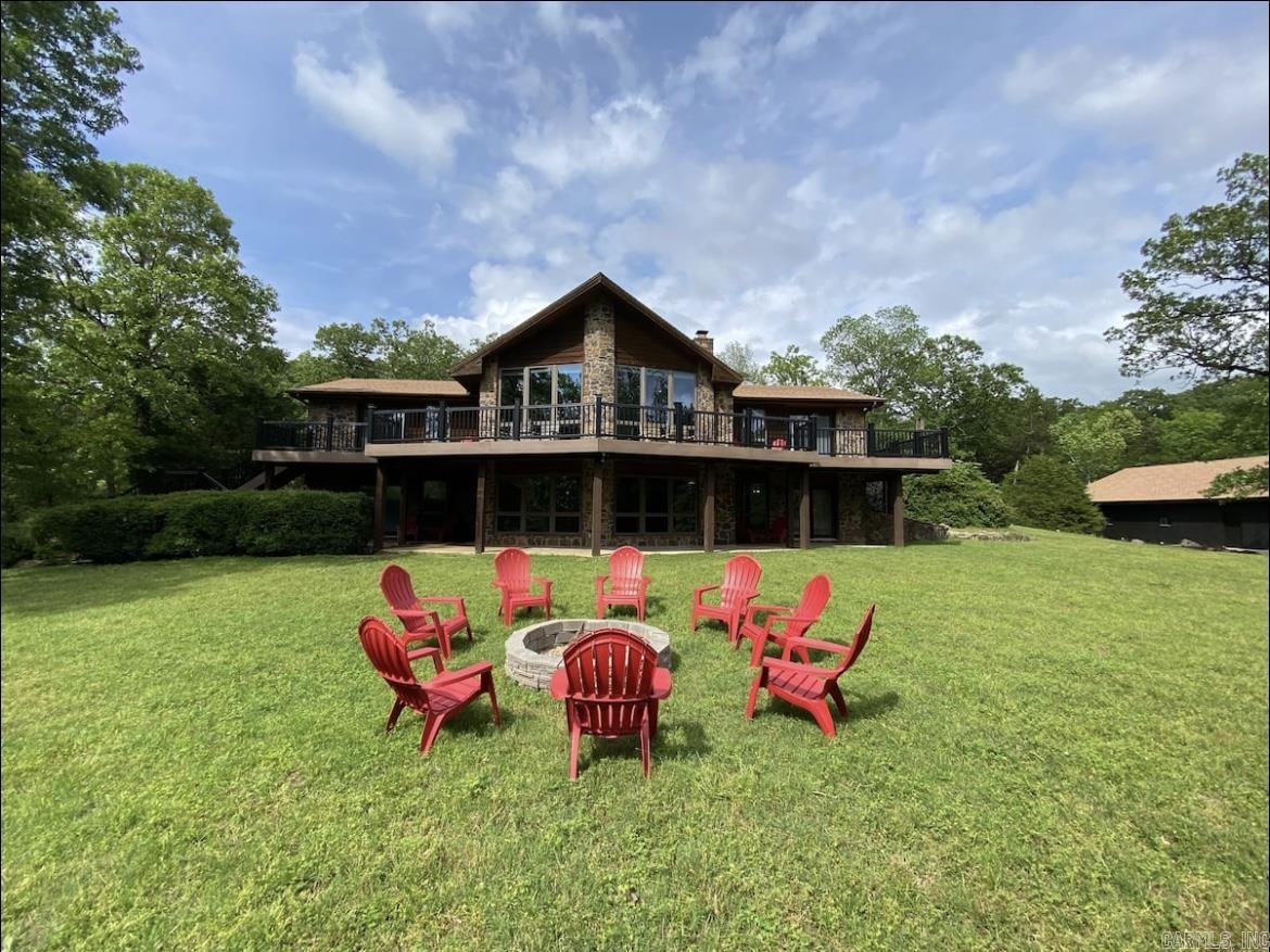One-of-a-kind luxury lodge with 2 additional guest cabins and 2-slip floating dock sits on 10.34+/- riverfront acres, and features 300-feet of White River frontage near Flippin, Arkansas. 2-story main lodge features 4,700+/- Sq Ft, 4 bedrooms, 4.5 bathrooms, chefs kitchen with high-end Viking and SubZero built-in appliances, 2 stone fireplaces, and Terracotta tile and hardwood floors. Each bedroom offers a private bathroom and outside deck. The property comes fully-furnished... truly a turn-key investment!