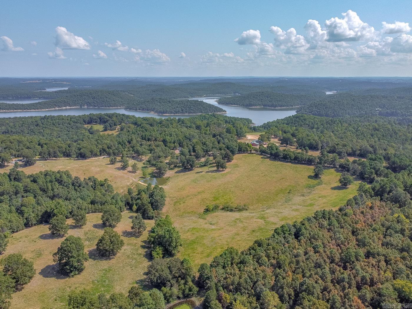 Welcome to Market 36.26 +/- acres on County Road 66 in Calico Rock, Arkansas. This vacant land is ready for its new owner to make it their own. Sitting close to Lake Norfork, this could be your next retreat, cattle farm or so much more. This property features a large pond and pasture ground as well as timber for shade. The pond is stocked, property is fully fenced for livestock, the property has a 640 foot well, utilities available on property. The seller loves the deer and turkey hunting. Call today to see this one!