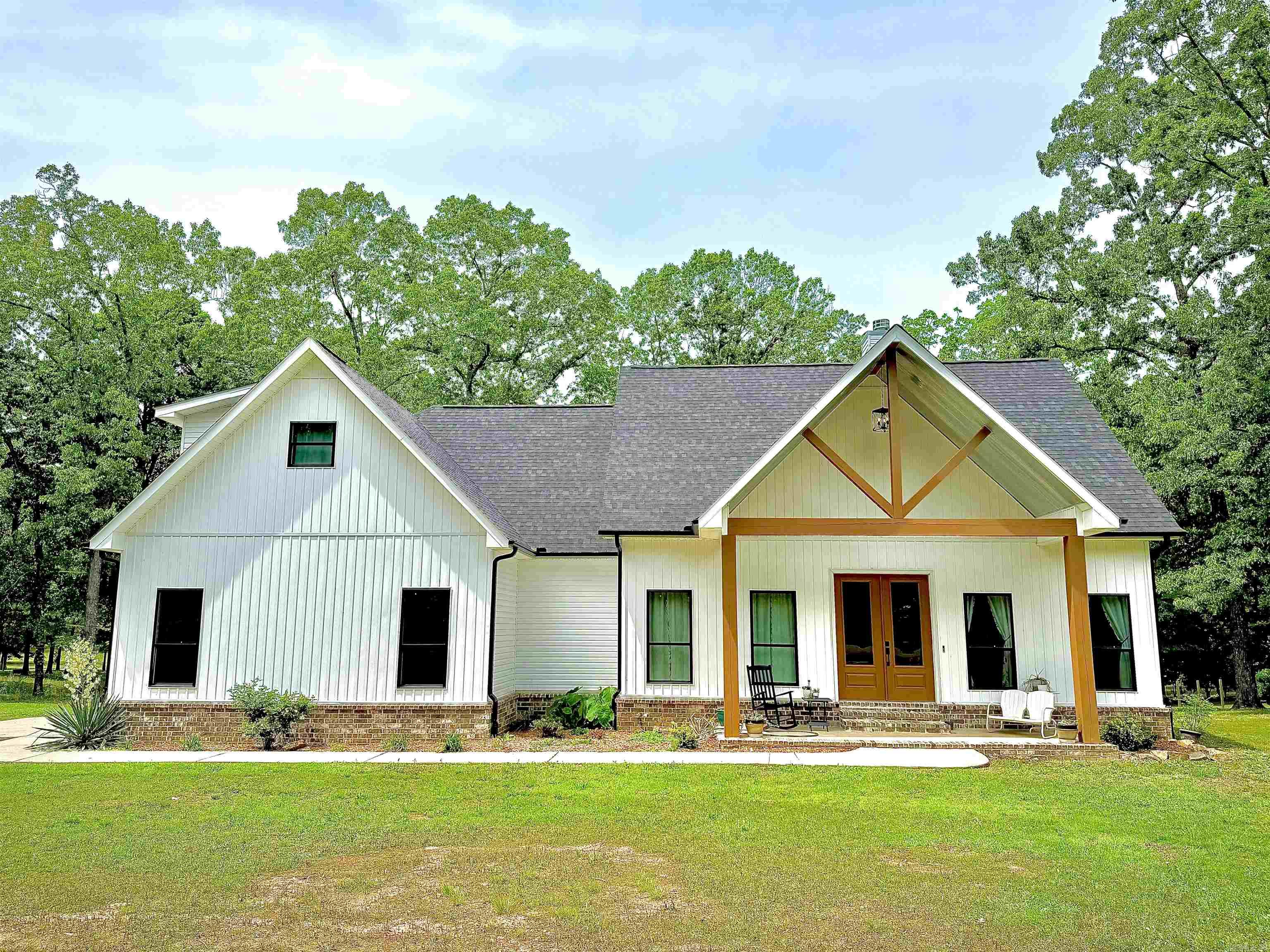 Looking for space to spread out without sacrificing comfort? This 4-bedroom, 3-bath home, built in 2022, sits on 3 peaceful acres just outside the city limits and offers the perfect balance of privacy and convenience—plus it’s located in the highly desirable Cabot School District.  Inside, the open floorplan makes everyday living feel effortless, with a spacious kitchen featuring leathered granite countertops that flows right into the main living area. The bedrooms are generously sized, all with walk-in closets, so no one has to fight for storage space.  The primary suite is a relaxing retreat, complete with a beautiful en suite and a large walk-in shower that might make you linger a little longer in the mornings.  Step out back and you’ll find a huge covered porch with a fireplace—perfect for quiet evenings or hosting friends—overlooking a tree-lined property that gives you room to breathe.  Comfortable, inviting, and just the right amount of tucked away—this one feels like home the moment you arrive.   SEE AGENT REMARKS