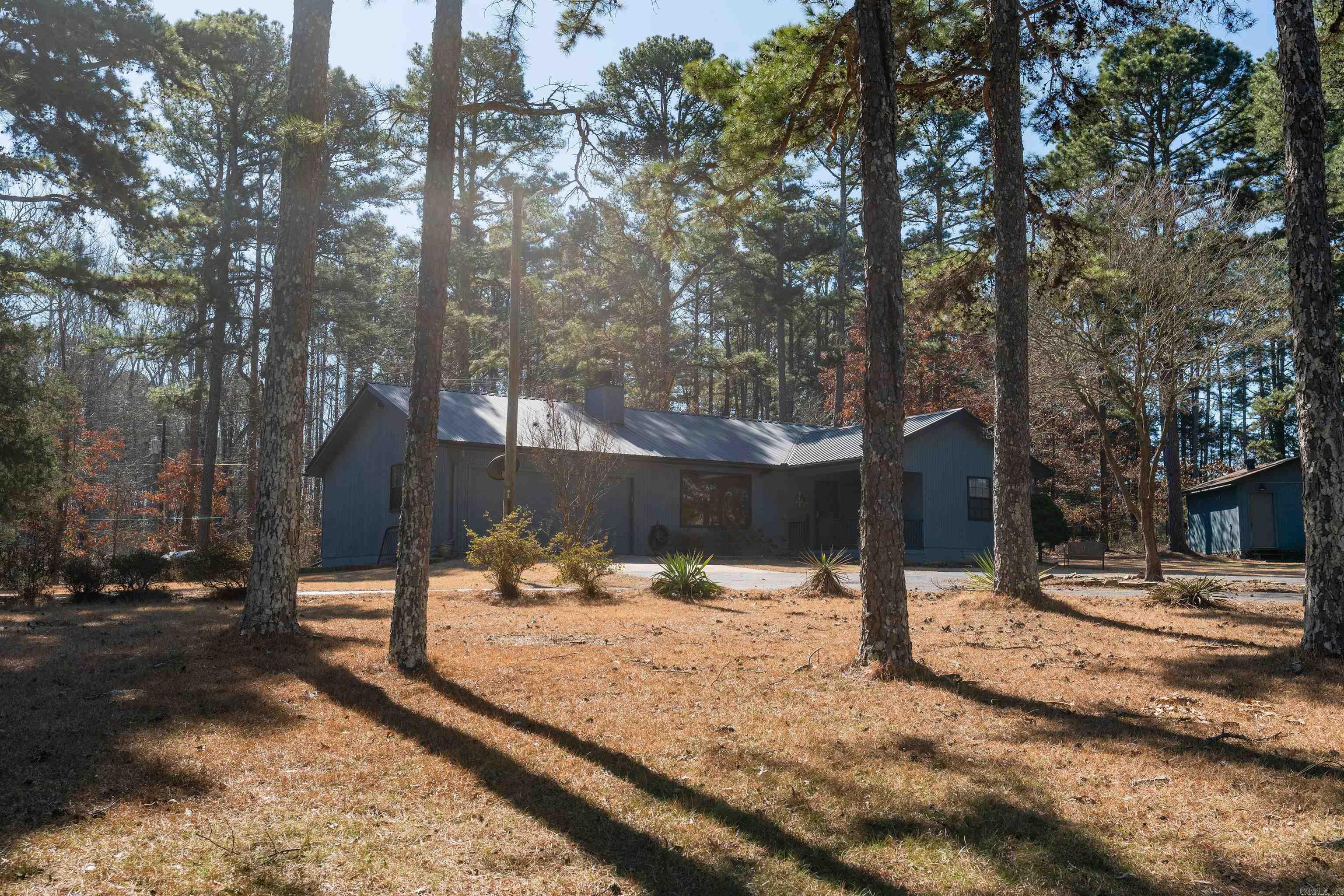 Located a few minutes outside of Heber Springs with 462 feet State Hwy frontage.   Home sits back off the road above a little Creek.  16x16 insulated shop/shed has double doors and electricity.  Commercial water heater, HVAC System, garbage disposal, motor and lift for garage door were all replaced 3 yrs ago.  Metal roof repaired and painted 1 yr ago.  Cell service improved by tower and tower booster.  Vaulted ceiling in living room, gas log fireplace. Spacious laundry room contains large bonus area.  Back deck off kitchen is wonderful for morning coffee and cookouts. See Attached Documents.