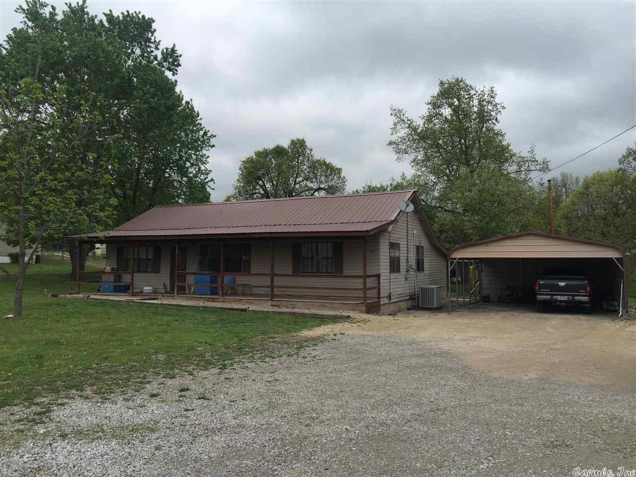 In town home for sale in Fulton Co. AR. This home has approx 1560 sq ft and a large .80 acre lot. There is 4 bedrooms 1.5 bathrooms, an eat in kitchen with locally made real wood cabinets, a metal carport, and 2 out buildings. The house is currently being rented for $650 a month. Call today to show!