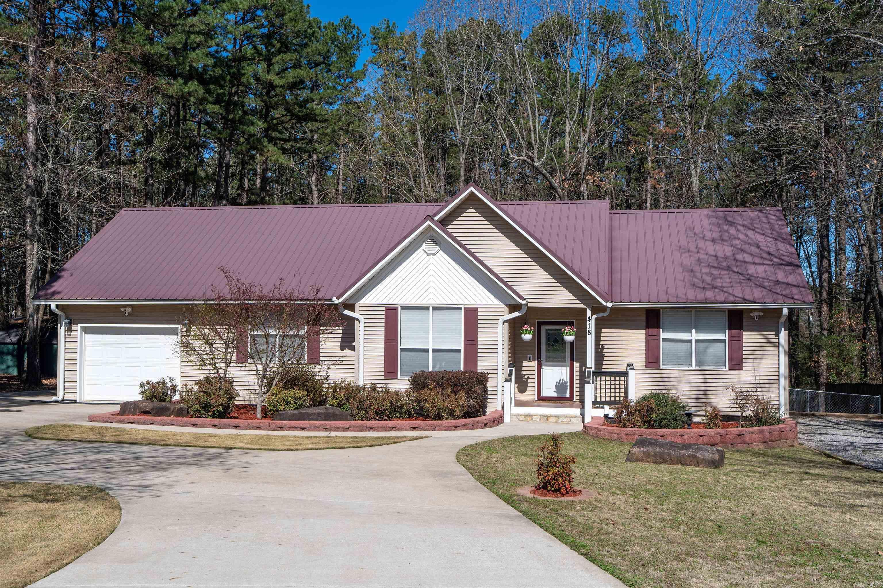 Experience modern elegance in this fully remodeled 4-bedroom, 3-bathroom home in the heart of Heber Springs, Arkansas. Boasting high-end updates and thoughtful design, it’s the perfect blend of contemporary style and comfortable family living—ready for immediate move-in. Inside, enjoy stunning granite countertops in the kitchen, spacious large bathrooms and a large laundry room. The four generous bedrooms offer flexibility for family, guests, or a home office, with three full baths ensuring everyday ease.  Step outside to low-maintenance luxury: a durable metal roof, fully fenced backyard ideal for pets or play, and an inviting outdoor oasis featuring a screened-in porch patio, relaxing pergola swing, cozy firepit, and a striking custom stone walkway that enhances curb appeal. Additional perks include a practical garage, ample storage, and countless other upgrades too numerous to list—this home truly shines. Located in welcoming Heber Springs, you’re minutes from Greers Ferry Lake, multiple marinas, shops, dining, schools, and endless outdoor adventures. Ideal for a peaceful retreat or vibrant family lifestyle. Call an agent today!!