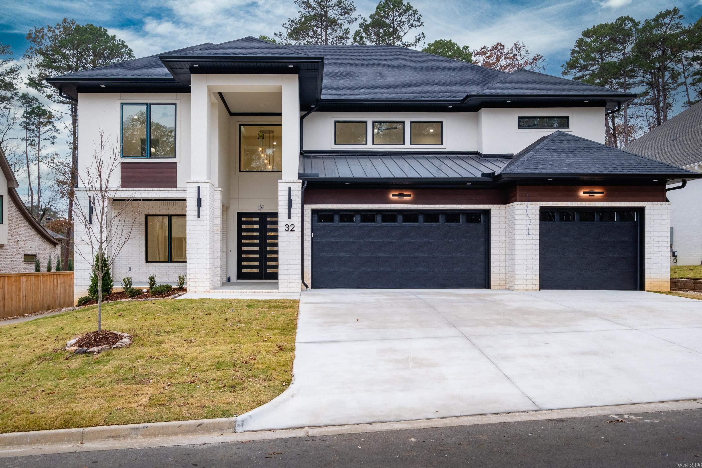 Welcome to 32 Mereville Place, a beautifully designed home still under construction—giving buyers the exciting opportunity to choose their elaborate finish-out, including flooring, paint, and fixtures. Centrally located next to The Promenade at Chenal, this home offers convenience, elegance, and custom potential all in one.  Enjoy two covered front porches—both upper and lower—for charming curb appeal and relaxation. A large sliding door off the kitchen and living room opens to the backyard, perfect for entertaining. Inside, you’ll find a media room and bonus room, providing ample space for large or growing families.  The primary suite and a secondary suite are both located on the main level, thoughtfully designed with a split layout for added privacy. An oversized three-car garage offers abundant storage and parking, and a small greenbelt buffer adds a touch of nature to the backyard. All of this is nestled in a secure, gated subdivision.