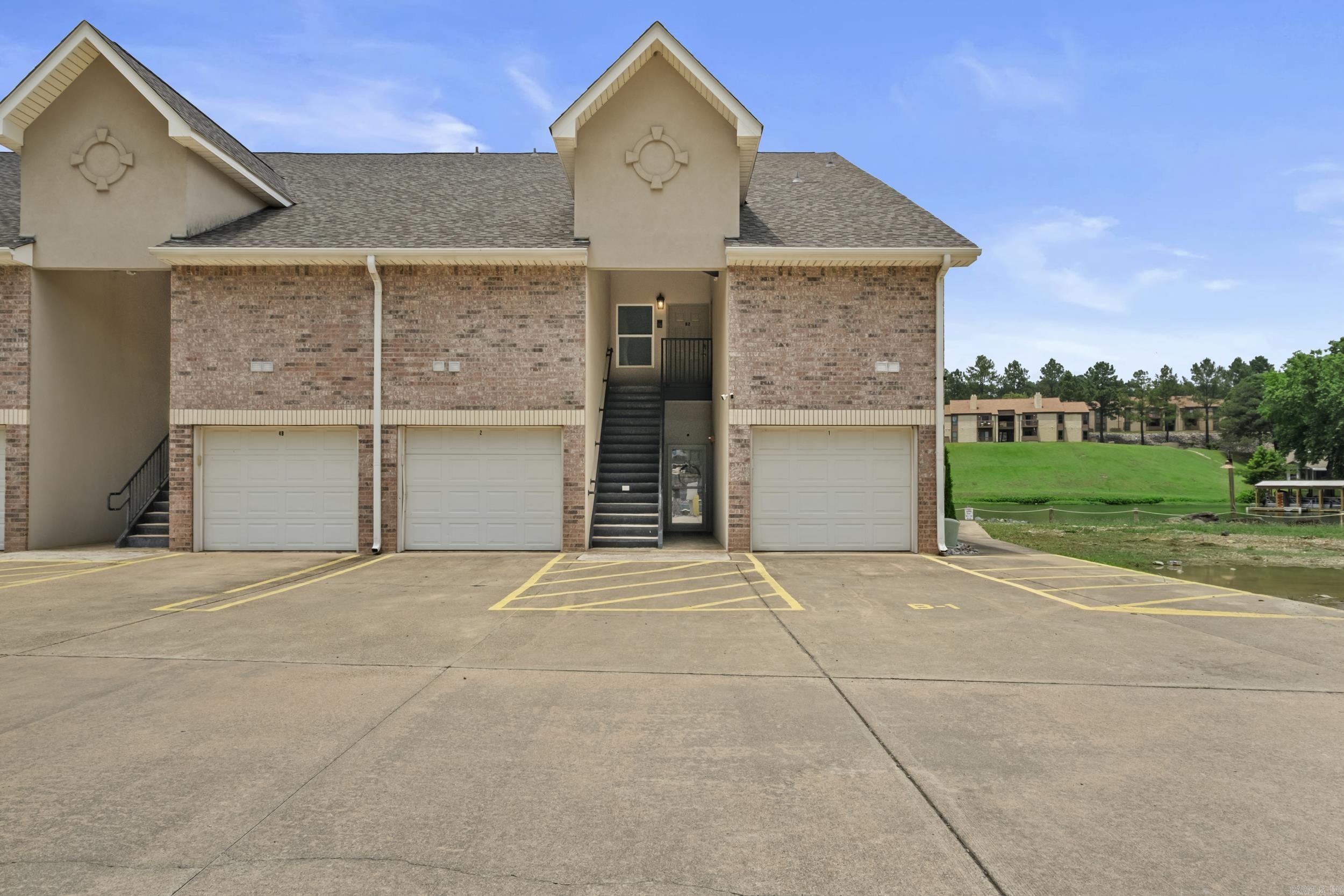 3 bedroom 3 bath lakefront condo on Lake Hamilton with a dedicated boat slip and heated and cooled storage area. This Lake Hamilton condo offers a functional layout with three bedrooms and three full baths, providing flexible space for full-time living, a lake getaway, or investment use. The lakefront setting and dedicated boat slip add convenient water access, while the conditioned storage area provides extra usable space for lake gear, hobbies, or seasonal items. A 3 bedroom 3 bath lakefront condo on Lake Hamilton with a dedicated boat slip and heated/cooled storage is a strong combination.