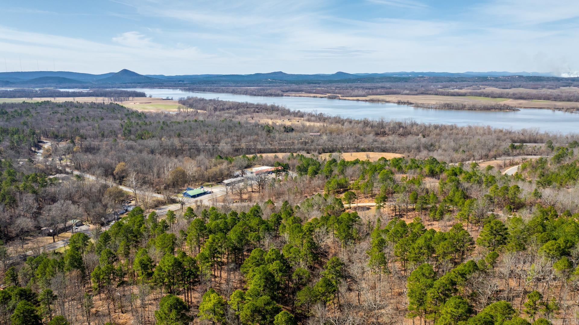 Luxury Living Starts with the Right Lot — Welcome to Mountain River.  If you’ve been waiting on the perfect place to build your dream home… this is it.  Located inside the gated, upscale community of Mountain River, 14000 Mountain River Drive offers breathtaking views of the Arkansas River and Pinnacle Mountain — a rare combination of privacy, security, and natural beauty just minutes from West Little Rock.  This premier homesite gives you options.  Two exceptional build sites — both positioned to capture those stunning river views. The upper site has already been cleared, opening up panoramic scenery and saving you time as you begin designing your custom residence.  Imagine: • Morning coffee overlooking the Arkansas River • Evening sunsets behind Pinnacle Mountain • A private, park-like hillside setting • Gated access for peace of mind  Mountain River is known for its luxury homes, natural surroundings, and elevated lifestyle.   Opportunities to build with views like this don’t come around often.  Come walk it in person. Stand on the upper site. Look out over the water.  Let’s build it.