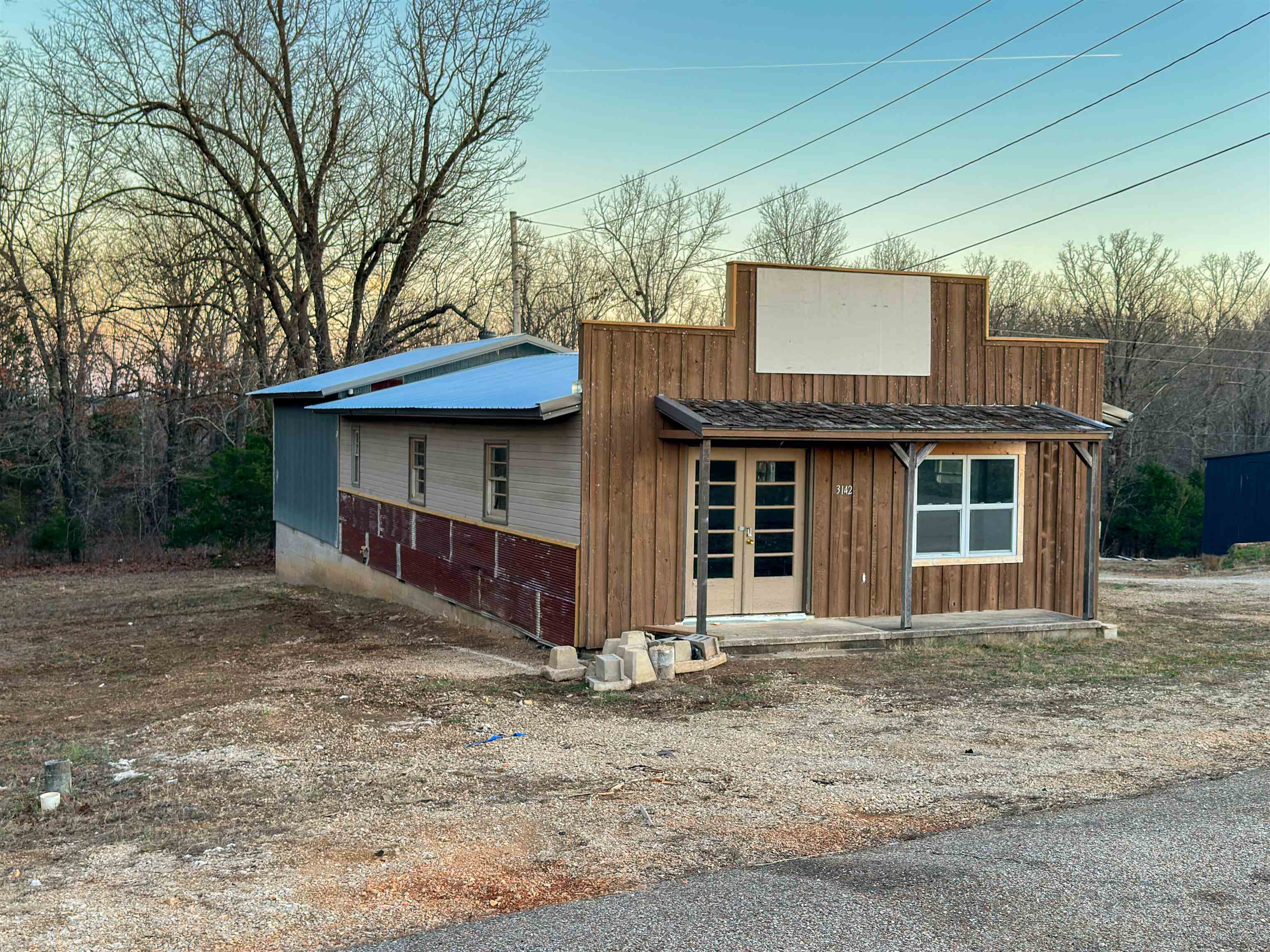 Versatile 1,584 SQ FT Commercial Building Ready for Your Vision! Seize the opportunity to own a high-visibility piece of the Highway 62/412 corridor! Located at 3142 Highway 62/412 in Highland, this 1,584 sq. ft. commercial building is perfectly positioned to capture the attention of thousands of daily commuters traveling between Mountain Home and Jonesboro. Designed with versatility in mind, this property offers a functional layout that serves a variety of business needs:  The retail/showroom provides a blank-canvas, unfinished retail space at the front allows you to customize the aesthetic and layout to match your brand without the cost of demolition. A dedicated office space provides an administration or private consultations, and the large workspace in the rear is ideal for inventory, light manufacturing, or a trade-based staging area. The property also includes a half bath and easy access for clients and deliveries.  Whether you are a local entrepreneur looking to stop paying rent and start building equity, or a regional business seeking a satellite office this could be the property for you. Call today and schedule a walk-through.
