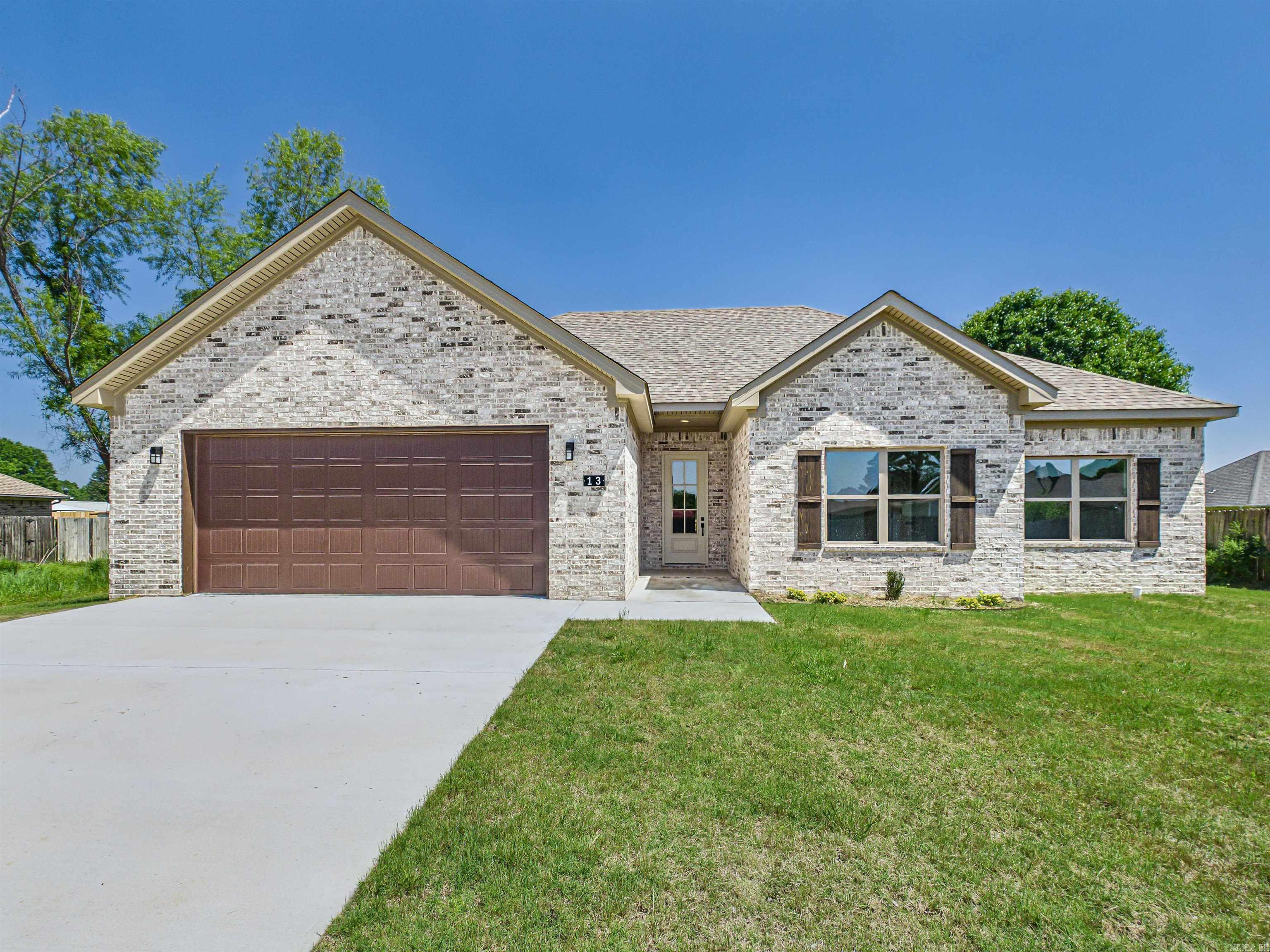 This NEW CONSTRUCTION and ALL BRICK beautifully appointed 3 bed, 2 bath home blends style and comfort with an open layout. Tall ceilings, beautiful trim work lvp throughout and a STUNNING statement fireplace wall. The kitchen shines with quartz countertops, gold fixtures, pantry, ss appliances and modern appeal,  The primary bath includes a gorgeous tile shower, vessel tub and so much more. Enjoy mornings on the back porch and evenings in the large backyard—perfect for making memories. Huge fenced yard! This location is so convenient for family and friend activities with the Weaver Family Park area and Vilonia Softball Complex within walking distance! This is a must see. ** See remarks**