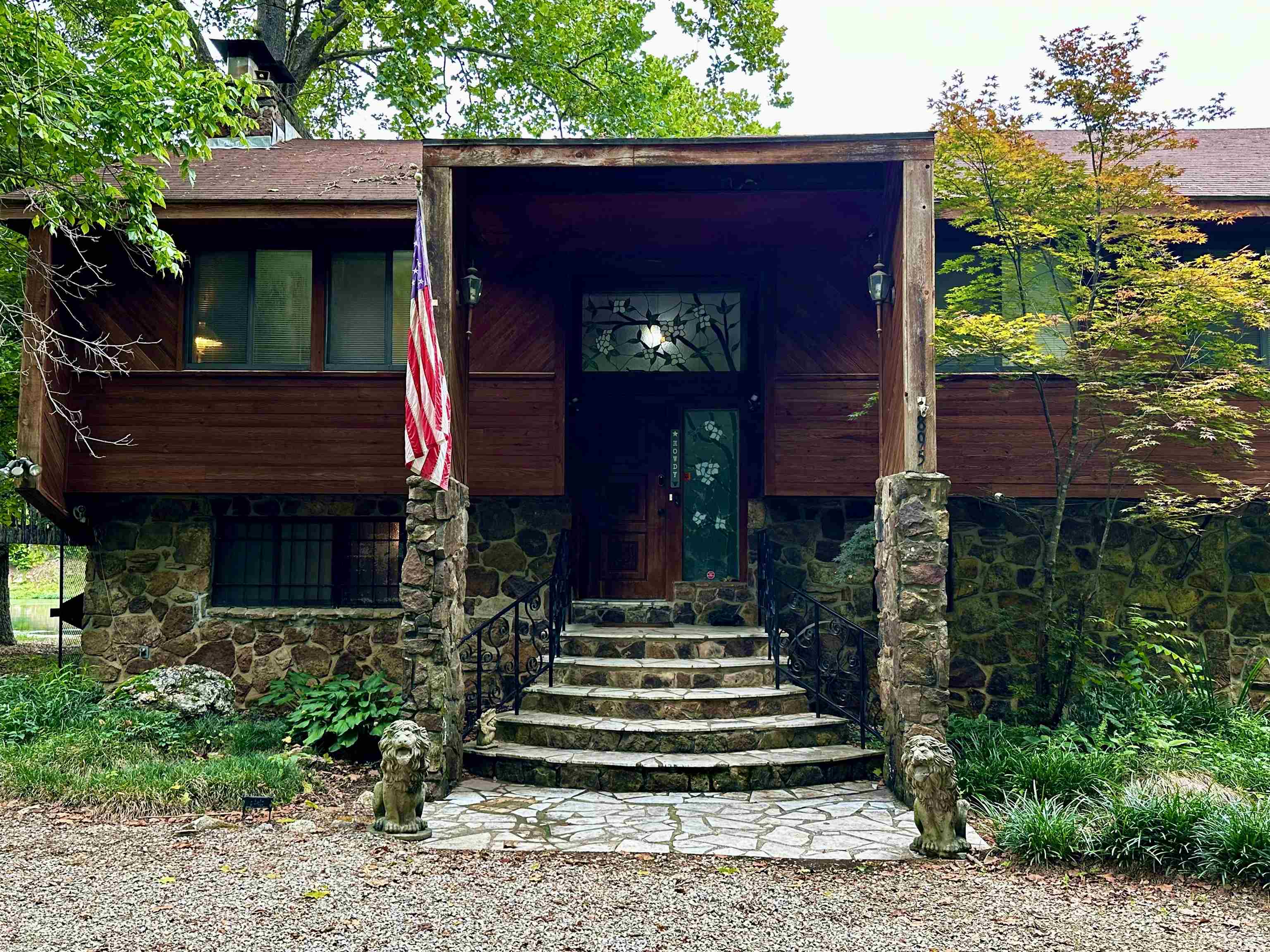 "SPRING RIVER -TEXAS ROAD HOUSE LODGE', The Ultimate Place at the River's Edge! This 6 bedroom 3 bath river home overlooking white water shoals waterway offers excellent trout fishing, canoeing, kayaking, rafting & other river activities. The cypress & native stone home features and elegant stained glass entry which leads into a high vaulted great room with a soaring stone fireplace. The kitchen features custom cypress cabinetry with a generous dining/living entertaining area. The dining room  opens onto the covered deck overlooking the canoeing, kayaking & river waterfalls. The primary bedroom suite w/bath & two guest bedrooms with another bath on this level. Downstairs is another generous living/bunk room w/fireplace insert. Also, 2 other bedrooms, another 3/4 bath, laundry area & a game room. There is a large detached 2 car garage, sand beach area, boat launch & small playground. Property is almost 1 acre. There is a catwalk connecting the house to a unique tree house This could be your river vacation get-a-way or a lucrative investment property. Presently, it is generating income as an Air B&B with family having privileges when they want to stay. This is a must see.