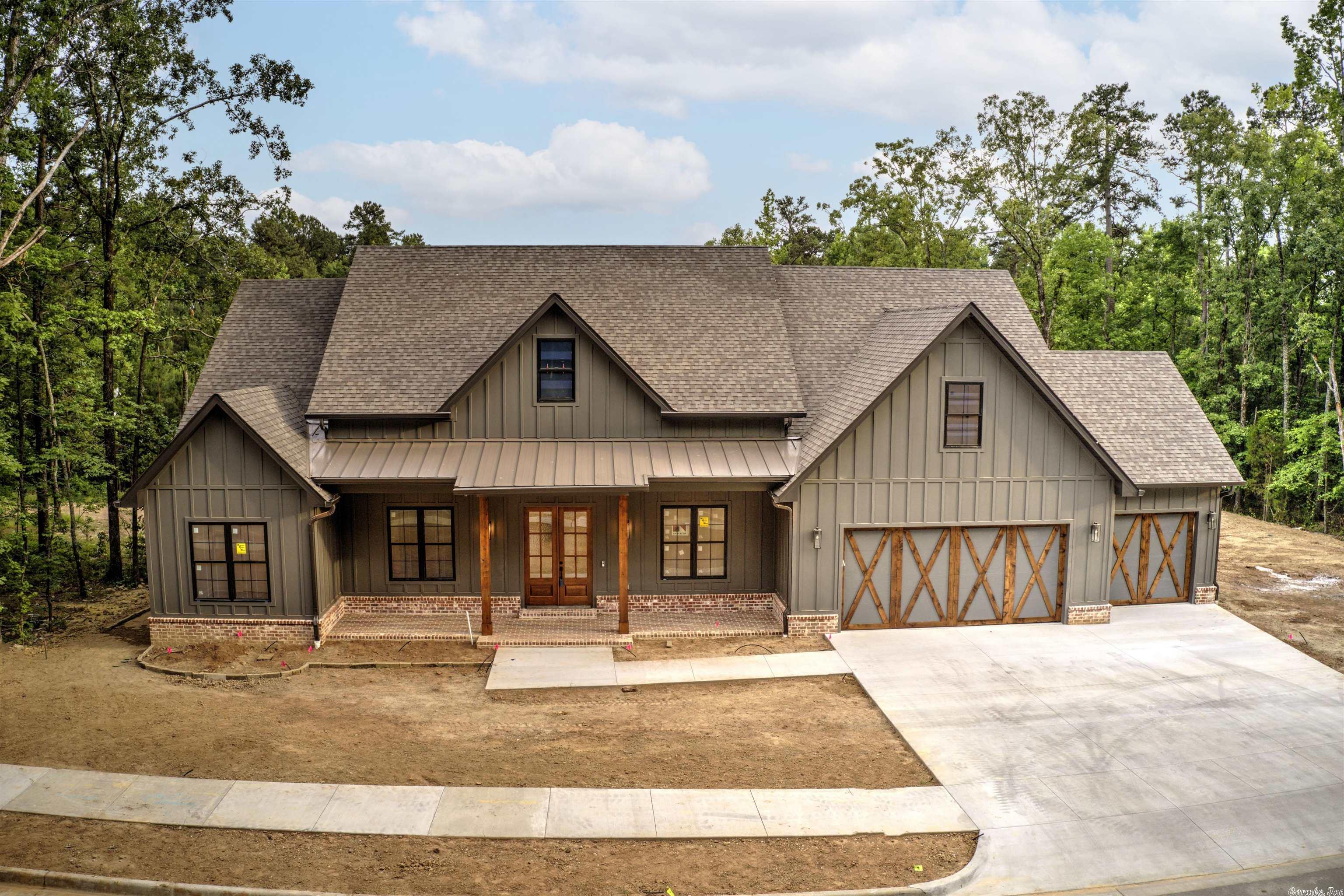 Beautiful Newly Constructed Craftsman Style home located in the New Bear Den Estates. This home is located in a cul de sac near the Green Space. This home has all the luxury you want. Speakers throughout and a kitchen that opens up to a beautiful wood burning fireplace.  Master suite with huge walk in closet and an en suite bath that feels like a spa. The other three bedrooms are roomy, nice, extras in this home. This is a must see from office space, butlers pantry, top security system, fire pit, sprinkler system to a laundry room that even has a dog station. The home has a two car garage and golf cart garage. This home is truly worthy to come see. Call for details or come see!