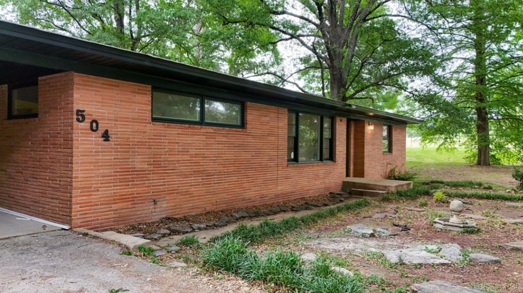 Midcentury modern dream home situated on a spacious .62 (+/-) acre lot! This move-in ready property features an open and inviting layout with tasteful updates throughout. The kitchen has been opened up to make it perfect for entertaining with brand-new appliances and modern finishes. A custom-built mudroom adds functionality, offering the perfect drop zone for everyday living. This home also provides major storage and flex space perfect for collectors or crafters of any sort. Enjoy relaxing year-round on the screened-in back porch overlooking the large backyard with plenty of room to play, garden, or entertain. Combining comfort, style, and space, this home is ready for its next owner to enjoy!