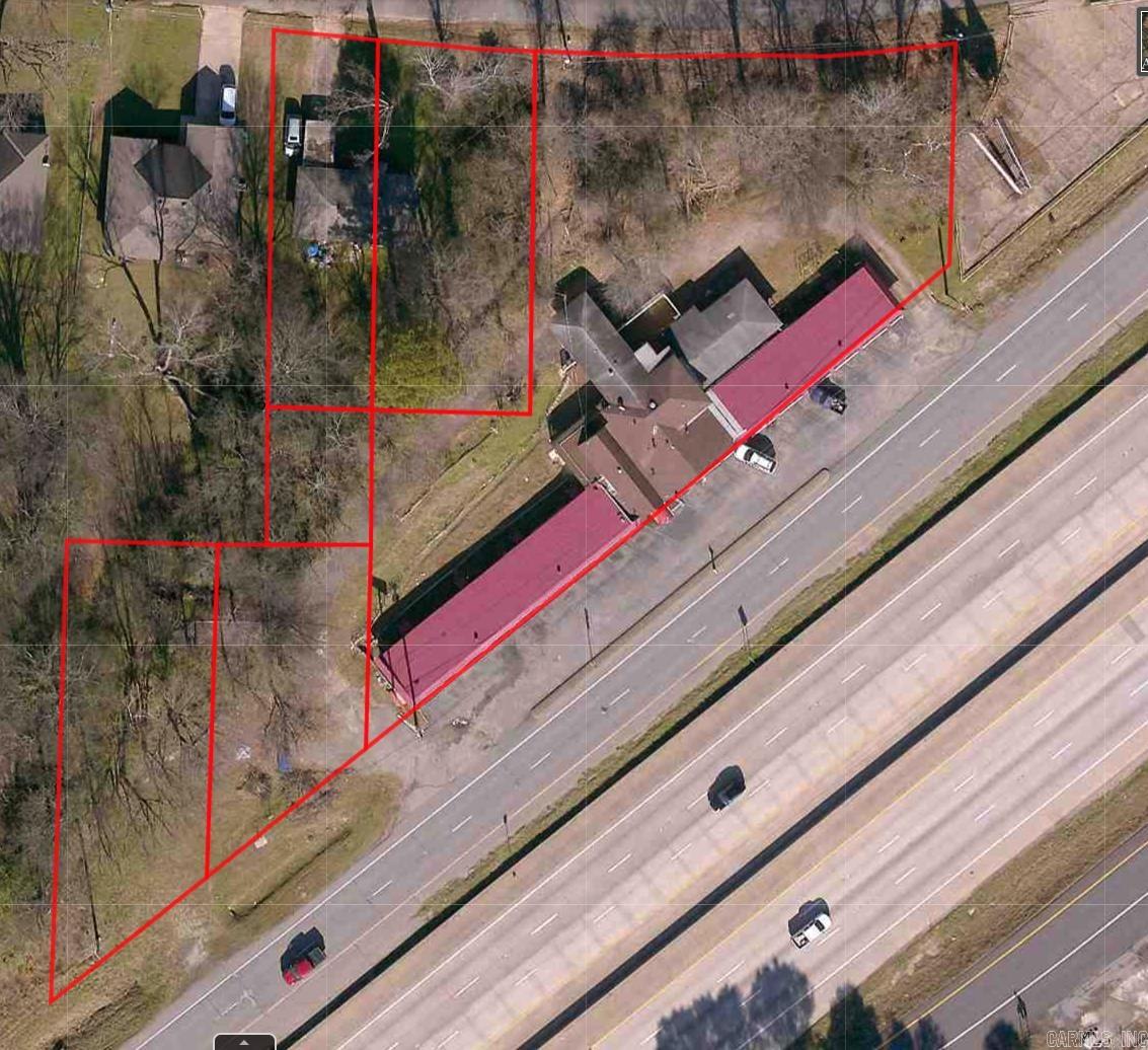 Selling price negotiable!! Unlock the potential of this rare commercial offering located directly off I-30 in booming Benton, AR. Spanning six bordering lots, this property includes the well-known Cedar Wood Inn, a charming Single-Family Home, and ample open space ideal for future development. With high visibility, easy access, and over 500 feet of interstate frontage, this site is perfectly positioned for a wide range of uses—hospitality, retail, multi-family, or mixed-use development. Whether you're looking to redevelop, reposition, or expand your portfolio, the possibilities here are as big as your vision. Zoned for success and priced for action—don’t miss out on this gateway opportunity in one of Central Arkansas’s fastest-growing corridors.Disclaimer: Information provided is for general purposes only. All details, including square footage, unit sizes, and renovation plans, are close approximations, with no guarantees regarding accuracy. The agent/broker makes no representations or warranties, expressed or implied, regarding the property.