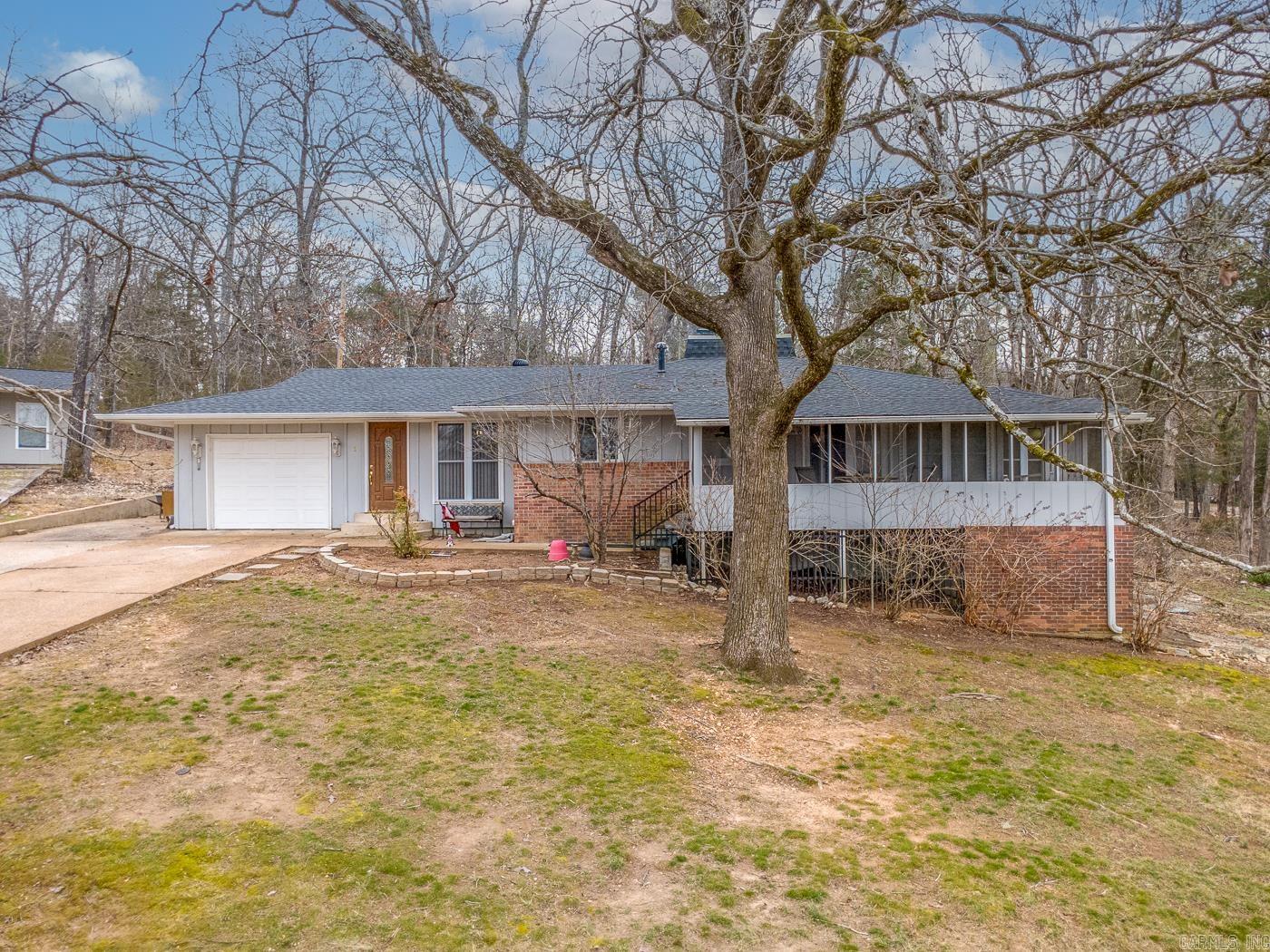 Welcome to Market 1 Nokomis Dr of the Fairway & Samoset Subs in Cherokee Village, AR. Situated on .65 +/- acres across 2 parcels is a 1,631 sf 3 bedroom, 2.5 bath ranch-style home wrapped in wood and brick with guttering, 1-car garage, screened front porch, covered back patio, 10x8 shed, and 28x12 flex space. Vaulted ceilings w/ exposed beams and a wood-burning fireplace w/ marble surround highlight the main living area. The kitchen, living, and dining areas offer an open-concept feel, and a separate den provides additional living space. The primary suite includes a full bath w/ walk-in shower and walk-in closet. A 2nd bedroom features a half bath en-suite. The home also includes a 3rd bedroom, guest bath w/ shower/tub combo, laundry space, and additional storage. A walk-in crawl space provides under-house storage. The 28x12 flex space offers power, water, commode, sink, and a h/c window unit. Positioned near the South Fork River and the Cherokee Village North Golf Course. Cherokee Village offers 7 lakes, 2 18-hole golf courses, swimming pools, parks, trails, tennis, and more. Call today to make this house your home, home away from home, or next addition to your rental portfolio.