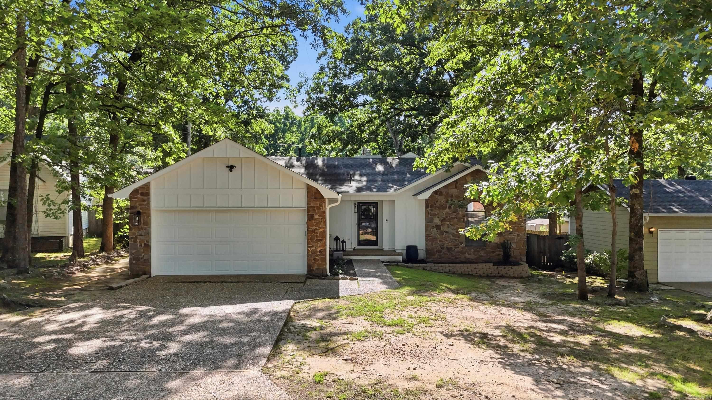 Welcome to Shadow Ridge Lane! Close in on the west of Little rock, this charming 3-bedroom, 2-bath home offers the perfect combination of comfort and accessibility. Inside, you’ll find a spacious living area centered around a cozy wood-burning fireplace, creating a warm and inviting place to gather. The wonderful kitchen offers plenty of space for cooking and entertaining, while updated flooring throughout adds a fresh, modern feel. Each bedroom is generously sized, providing comfort and flexibility for family, guests, or a home office. Step outside to enjoy the large deck overlooking a peaceful wooded lot — the perfect spot for relaxing, grilling, or entertaining. With its great layout, recent updates, and convenient location, this home is ready for its next owner!