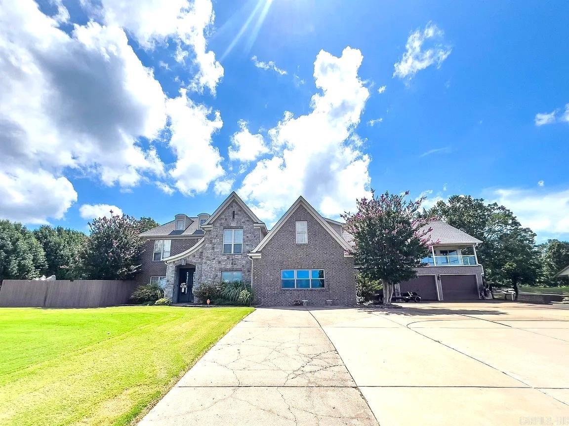 Discover exceptional space, comfort, and versatility in this stunning 6 bedroom, 4 bath home located in a highly desirable subdivision featuring a scenic neighborhood pond and breathtaking sunsets.  The main level is designed for both everyday living and entertaining, offering a spacious family room and inviting hearth room, each with its own cozy gas fireplace.  The well-appointed kitchen features granite countertops, tile backsplash, gas cooktop with electric oven, KitchenAid dishwasher and microwave, and abundant workspace.  Enjoy casual meals in the separate breakfast room or host special occasions in the spacious formal dining room. The main level also includes 3 bedrooms, highlighted by a primary suite with bath, plus an additional full hall bath.  Laundry room offers ample cabinetry and convenient cabinet for folding, while the attached 3 car garage provides plenty of storage. Upstairs, you'll find 3 additional bedrooms, a full bath and office.  A private in-law suite/gameroom above the garage includes a kitchenette and full bath, making it ideal for guests or recreational use. The backyard features kidney-shaped pool and nice patio.