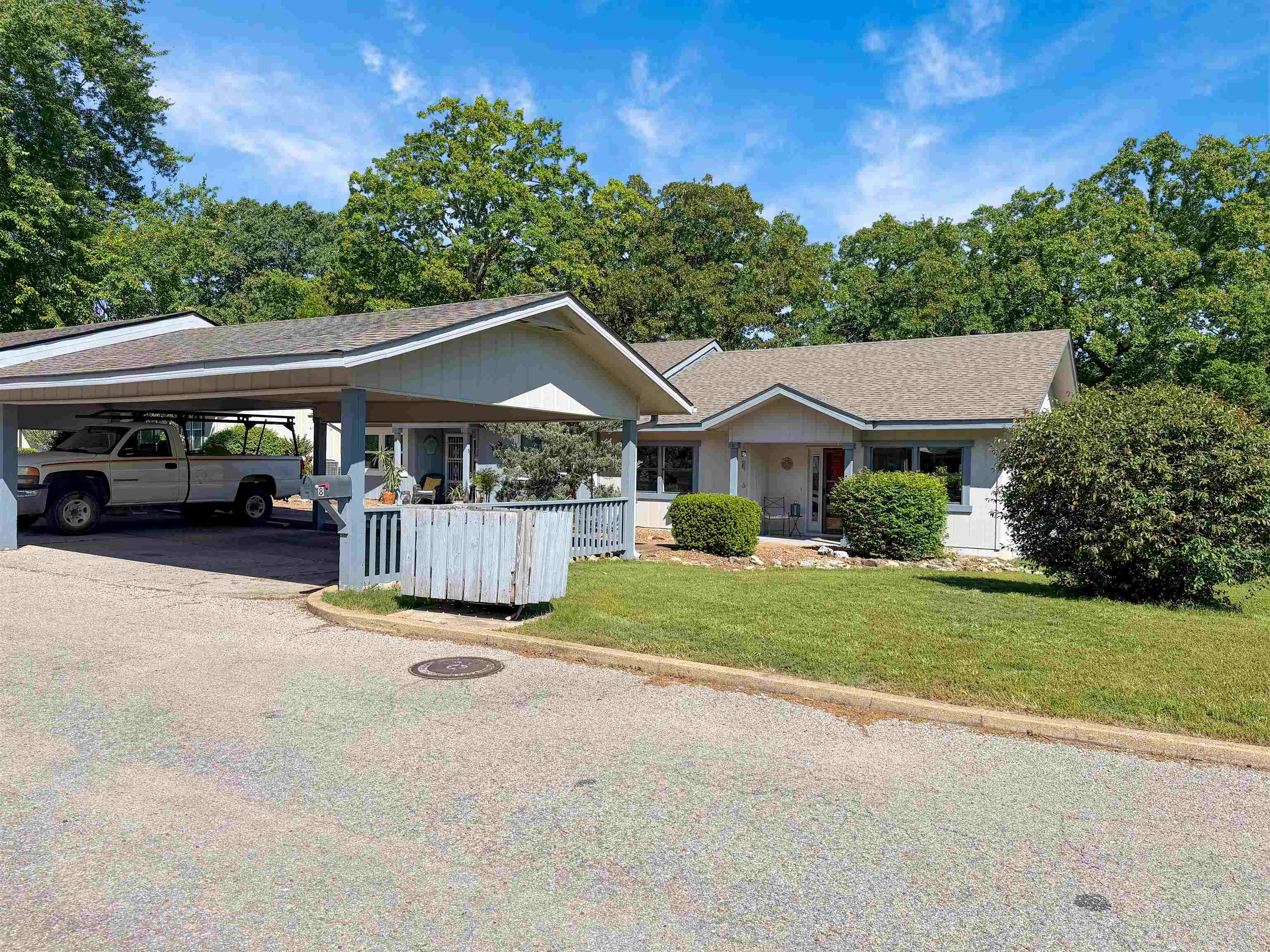 Discover the perfect blend of comfort and convenience in the heart of Cherokee Village! This charming single-story end unit townhouse with covered parking offers a rare sense of privacy and tranquility, featuring a large sunroom at the back where you can unwind while enjoying serene views of the surrounding woods. Inside, you’ll find a thoughtfully designed, spacious layout boasting two bedrooms connected by a functional Jack and Jill bathroom. Whether you are looking for a full-time residence or a weekend getaway, this home is designed for those who appreciate low-maintenance, easy living without sacrificing quality or space. Location is everything, and this property delivers. You are just moments away from the scenic South Fork of the Spring River, seven pristine lakes, and two championship 18-hole golf courses. From kayaking and fishing to hitting the links, outdoor adventure is always at your doorstep. Don't miss this opportunity to own a slice of Arkansas beauty at an unbeatable, affordable price. Experience the best of Cherokee Village living today!