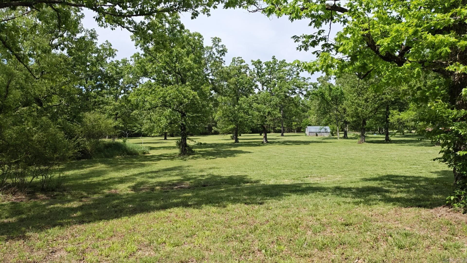 Build your dream home on this beautiful 5.38-acre property nestled in a quiet, park-like setting in Mountain View, Arkansas. Featuring large mature trees and a peaceful atmosphere, this property offers the perfect blend of privacy and convenience.  Paved street access  All utilities available along the front of the property  Quiet neighborhood  Minutes from the hospital, schools, shopping, restaurants, and Mountain View’s famous live music scene  Whether you’re looking to build your forever home, retirement retreat, or investment property, this scenic lot offers endless possibilities in one of Arkansas’s most charming communities.  $150,000.00  Call today for more information or to schedule a showing!