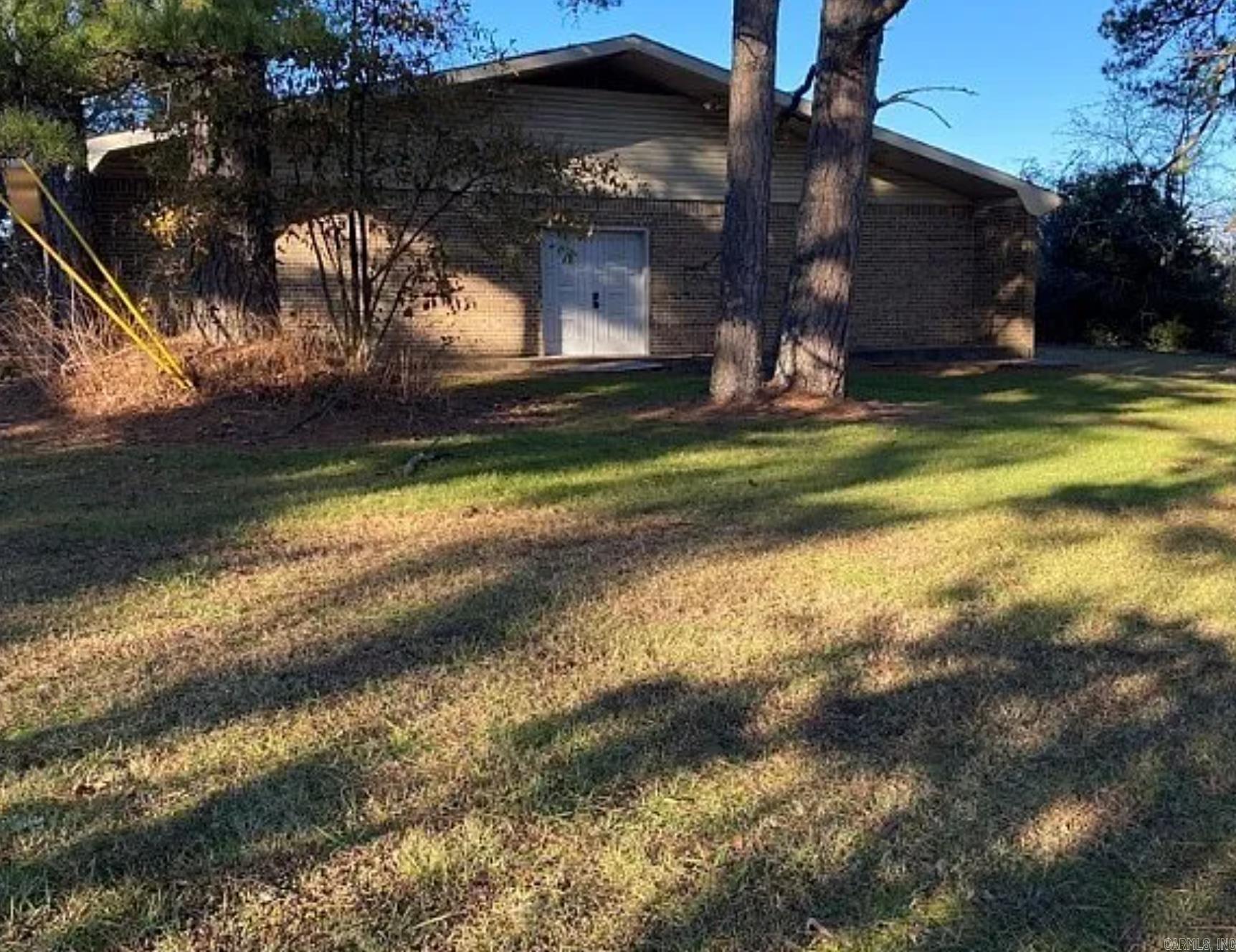 This property joins mls listing #1076496 but is being sold separate. Previously a church, this building has  so much potential. With a little TLC, and repairs, it could remain a church, or nonprofit building, or  residential. Zoned R1- Beautiful location, resting on a large 1.52 ac lot, with trees and the feel of the  country. The large 2848 sq ft building is brick, and concrete block, and on slab. public water and sewer  Central heat and air. It has 5 classrooms, a Baptistry, Office Sanctuary, nice size Foyer, with his and her  bathrooms. Building has the address 1232, but tax records show 1304 W hwy 248, because the church  closed down and it joins 1304 property again. To be sold as is . No sellers disclosure available.