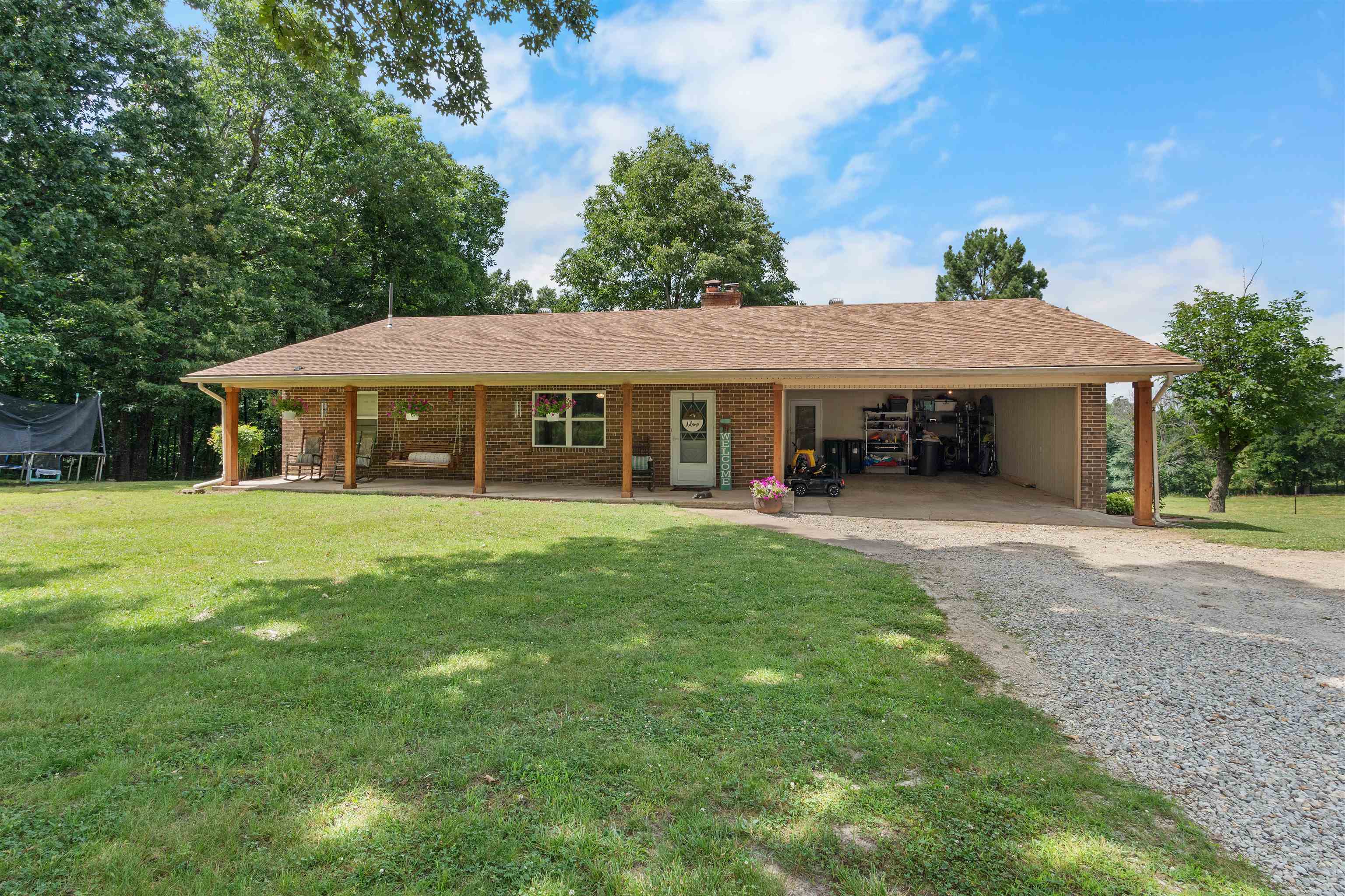 CHECK OUT this remodeled brick home with 4 bedrooms, 2.5 bathrooms on 5.93 acres with a pond! The main floor features a large living room with a gas fireplace, an open kitchen and dining area, a laundry room, half bath, master bedroom, and guest bedroom. Downstairs, the fully finished basement includes 2 additional bedrooms, a full bathroom, a second living area, kitchen, and storage space, perfect for guests, in-laws, or extra living space! The 5.93 acres is fully fenced and includes a pond, perfect for a hobby farm!  Additional features include a front porch, back deck, large front yard, and a 2 vehicle carport!