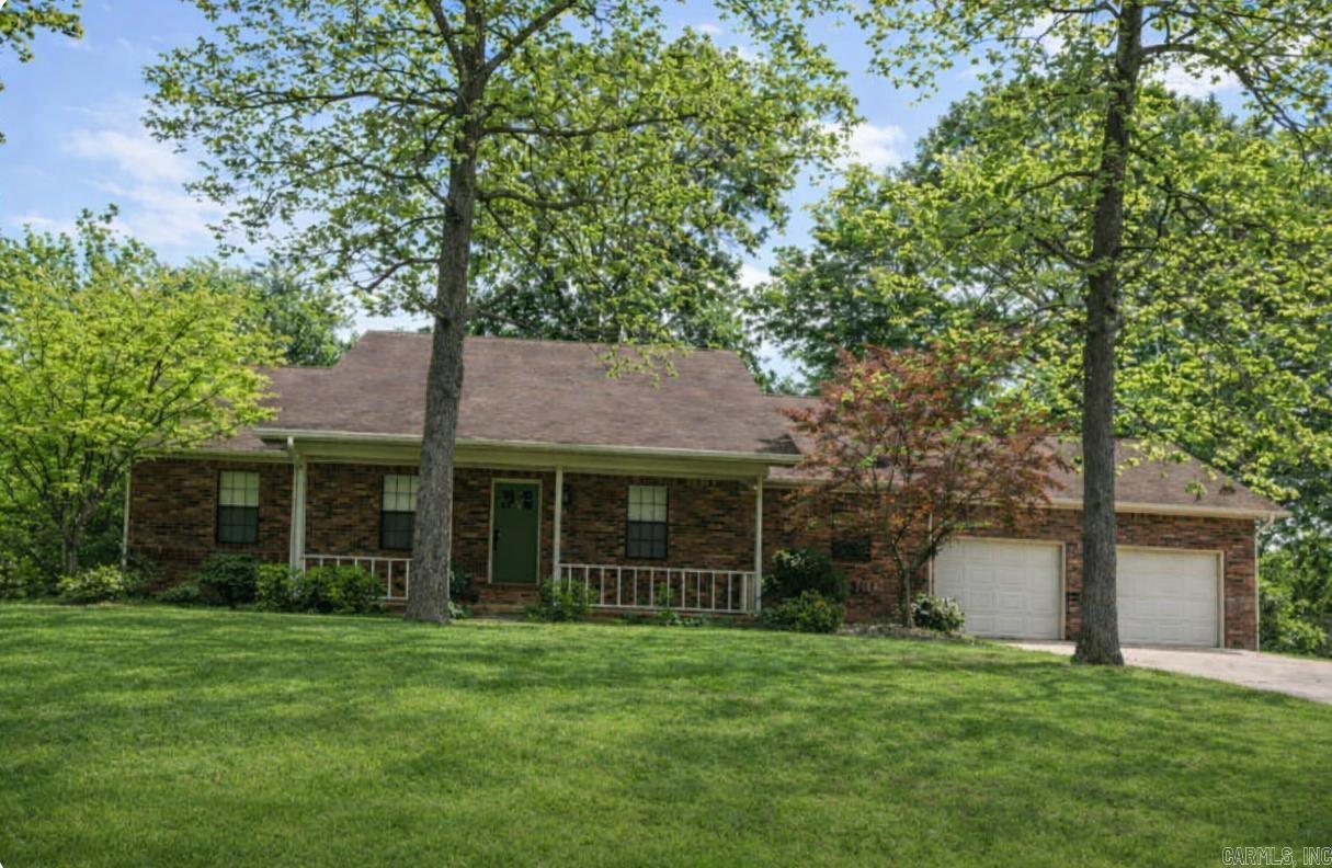 Experience true lake living in this beautifully appointed 5-bedroom, 3-bath home, offered fully furnished and designed for comfort, flexibility, and effortless enjoyment. Nestled on a nice, quiet street, this property delivers the space, light, and lifestyle today’s buyers are searching for. Inside, you’ll find large open living areas with tons of natural light, creating a warm and inviting atmosphere. The owner’s suite features a custom primary bathroom with elevated finishes. Downstairs, a spacious media/bonus room offers the perfect retreat for movies, games, or additional guest accommodations. Storage is exceptional, with an oversized double garage plus 500± sq ft of climate-controlled storage—ideal for lake gear, tools, or STR supplies. Enjoy instant access to the water with your covered boat slip. Located in a desirable lake community known for its low POA dues, residents enjoy premium amenities including an 18-hole sanctioned golf course, an Olympic-size swimming pool, clubhouse, and more. Whether you’re a family needing room to grow or weekender craving a true lake retreat, this home offers unmatched value, comfort, and versatility. Please call Gina for the specifics