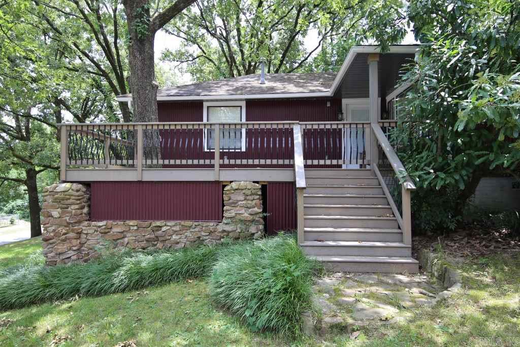 Great Mid-Century Home in Hillcrest – 3 bedrooms, 2 full baths.  Large living and dining combination with pretty wood picture windows.  Hardwood floors, Eat-in Kitchen with granite slab counters, breakfast bar and den with terracotta tile floor.  Cool corrugated metal sided exterior (2013).  Great new deck with covered seating area.  New A/C and Duct work (approx. 2012, 2013).  Corner lot and additional alley access.  See Agent remarks.