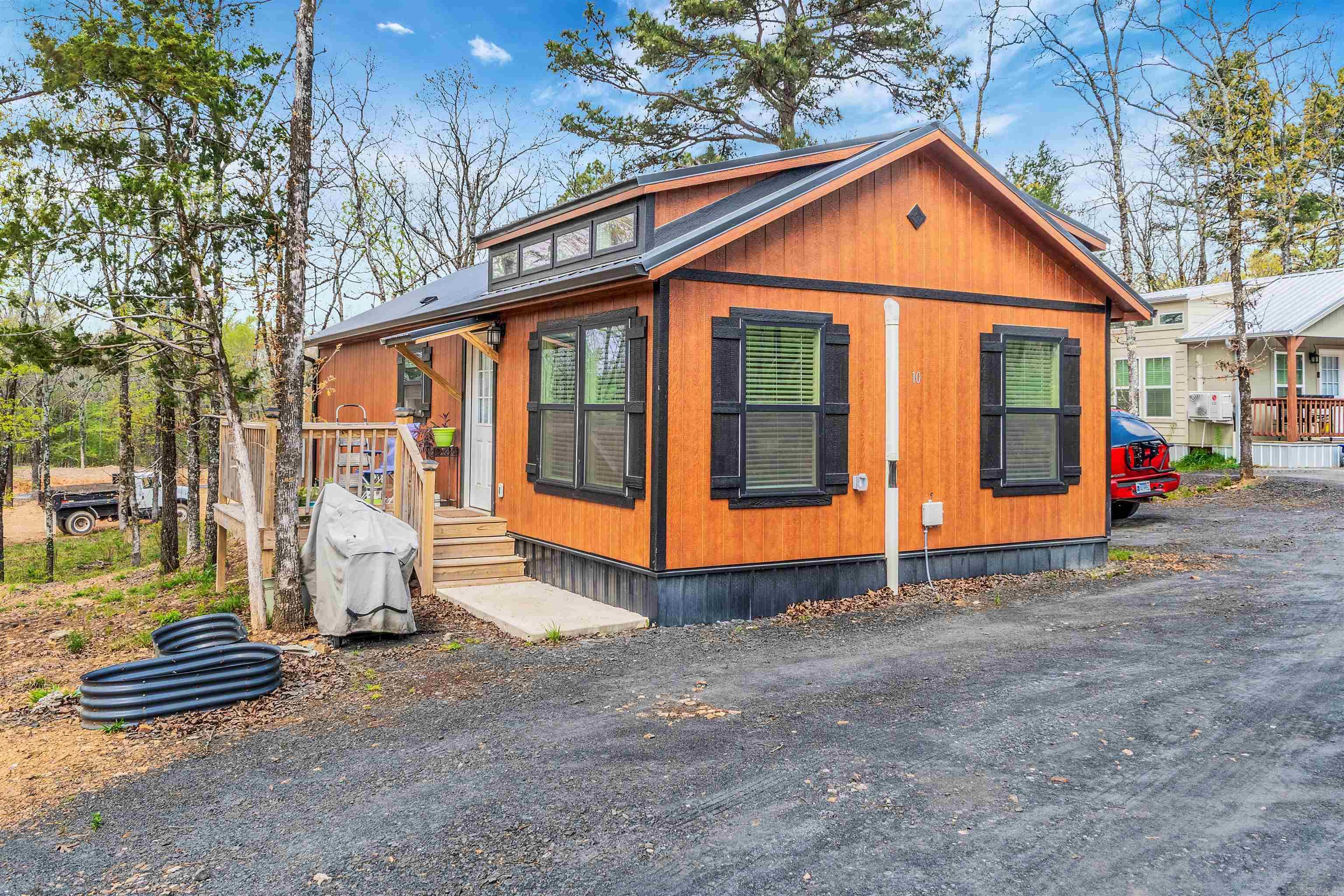 Welcome to Tiny Town - If you are looking to down-size for retirement or smaller space, this gorgeous 1 bed / 1 bath built in 2024, 720 Sq Ft is a part of a 16 Lot development that is the perfect place to call home. This home provides an open concept that is perfect for entertainment, easy & stress-free maintenance, small yard, great location, close to town, country living, Great Retirement Home, all appliances convey including W/D. Nice tongue and groove ceiling providing you the modern rustic feel. There is a Bill of Assurance in process to cover the responsibility of shared septic.  Sellers property disclosure will not be provided. Seller has not occupied property.
