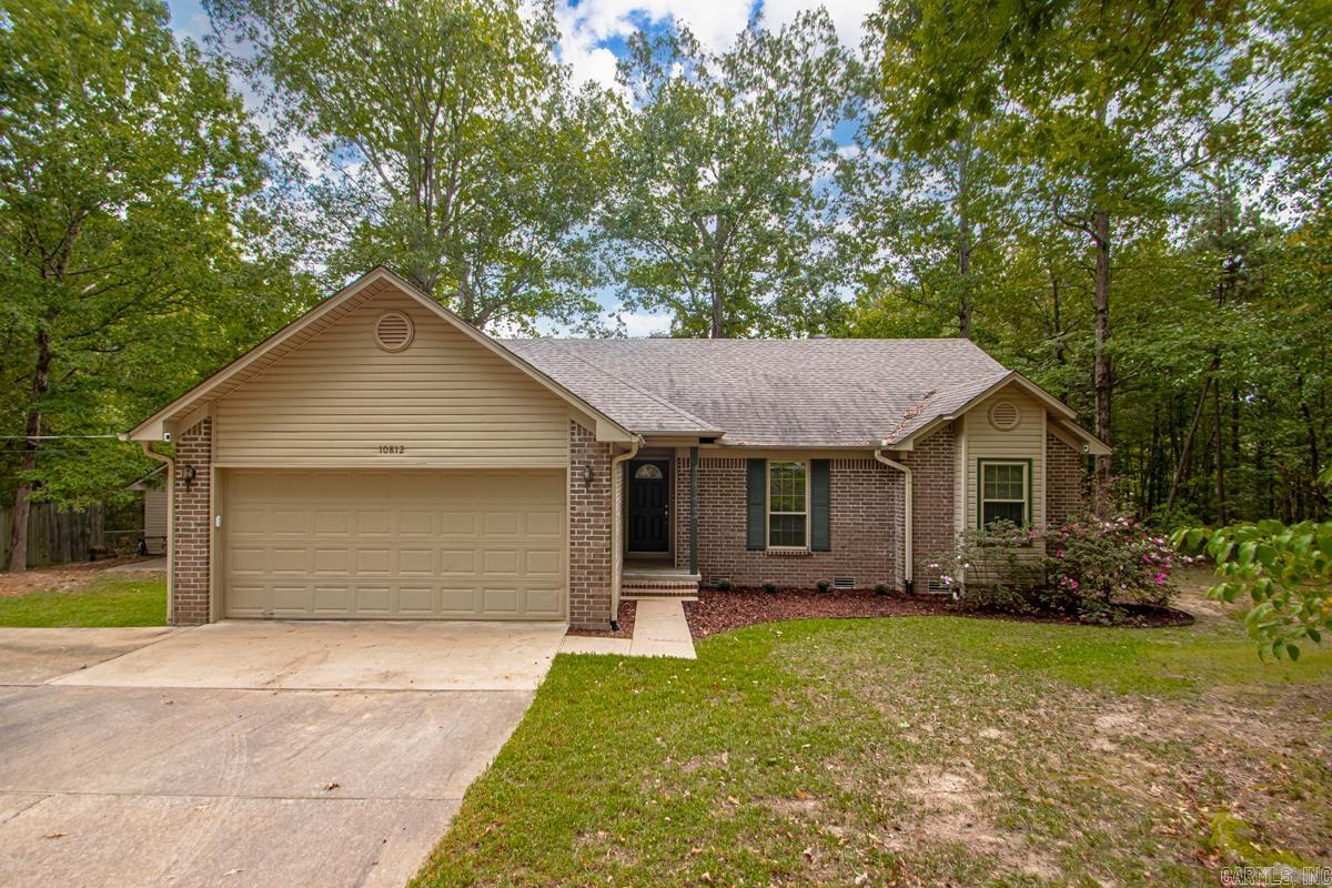 Well maintained one level house on almost an acre in Bryant School district!  This home has 3 bedrooms, 2 full baths, new updated appliances, new countertops & backsplash.  This house also has NEW WINDOWS, roof in 2018, & NEW deck!!!  There is also a 18 x 18 SHOP on the property with electricity and a garage door!  The living room hardwood floors, vaulted ceiling, and wood-burning fireplace with blowers.  You will love the view of the outdoors from the living room and kitchen!  The kitchen has been updated with new quartz countertops & a new backsplash.  There are also new appliances!!!  There are 2 guest bedrooms.  The primary bedroom is large with a vaulted ceiling.  Primary bath has shower and separate tub.  There is a separate laundry room.  Large garage.  Also, you can enjoy the outdoors on the new deck.  Great peaceful and tranquil setting!  Seller is offering a one year home warranty with acceptable offer!  Schedule your appointment today!