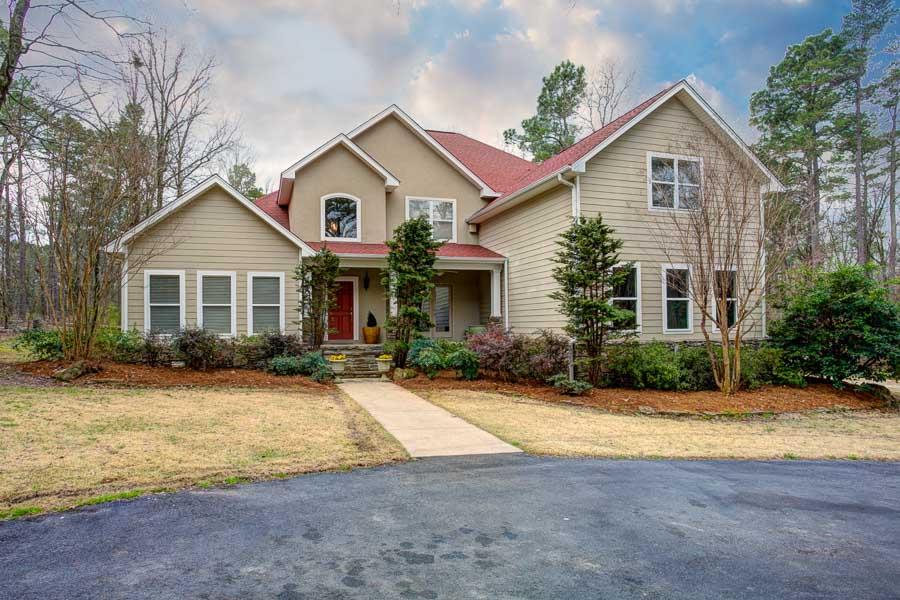 Amazing home in a gated subdivision on 5+ acres, only a few minutes from HWY 10. This one owner home has recently had many updates! It has beautiful newly refinished hardwoods throughout. Brand new kitchen including a marble slab island, all new appliances including double oven & custom back splash throughout.Ice maker,wet & dry bar & wine fridge. Two new fireplace mantles designed by Chris Milligan. New paint & much more. Two Master Suites-one upstairs & one down. Two living areas. Great for entertaining!