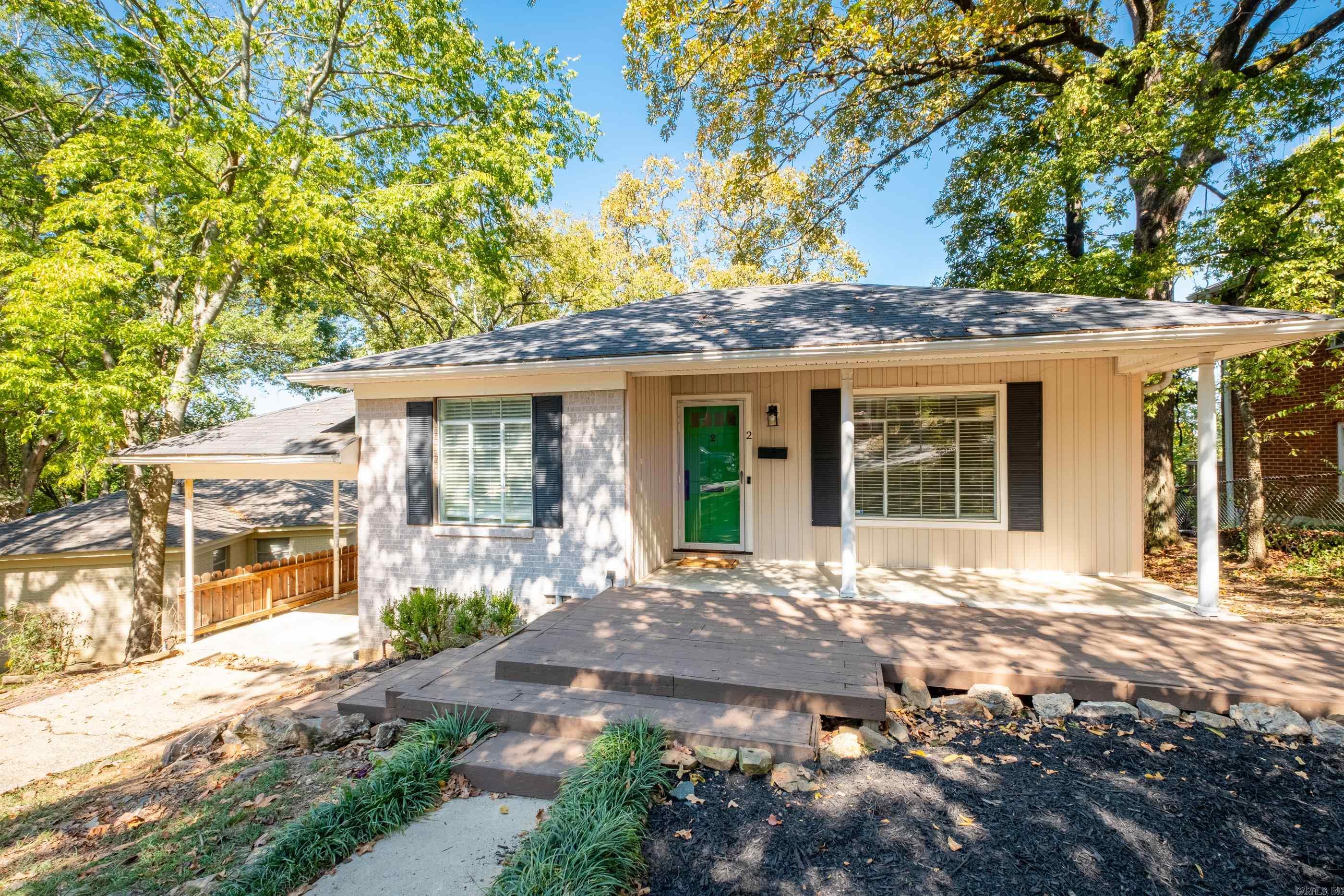 Beautiful home in the desirable Coolwood neighborhood of Riverdale with easy access to the River Trail and Allsopp Park, minutes away from the Hillcrest & Heights neighborhoods, and just one mile from Downtown Little Rock.  Step inside from the inviting covered front porch into the bright main living area with built in cabinets and abundant natural light.  The main level offers 2 bedrooms with walk in closets,  full bath, a cozy living room, dining room and kitchen equipped with granite countertops, gas stovetop and a stainless steel refrigerator.  The lower level boasts a versatile living space that can serve as a bedroom, office or hobby room, complete with a full bath and walkout to lower patio and fully fenced backyard. Outdoors, enjoy a spacious deck and green space, great for entertaining guests or savoring a quiet morning cup of coffee.  Updates include new dishwasher (2024), HVAC (2022), washing machine (2023), fresh interior paint (2024), deck painted (2024), new countertop & mirror in upstairs bathroom and updated subway tile shower in downstairs bathroom (2024). Refrigerator, washer, dryer and ring doorbell convey.  Do not miss this gem!  Please see agent remarks.