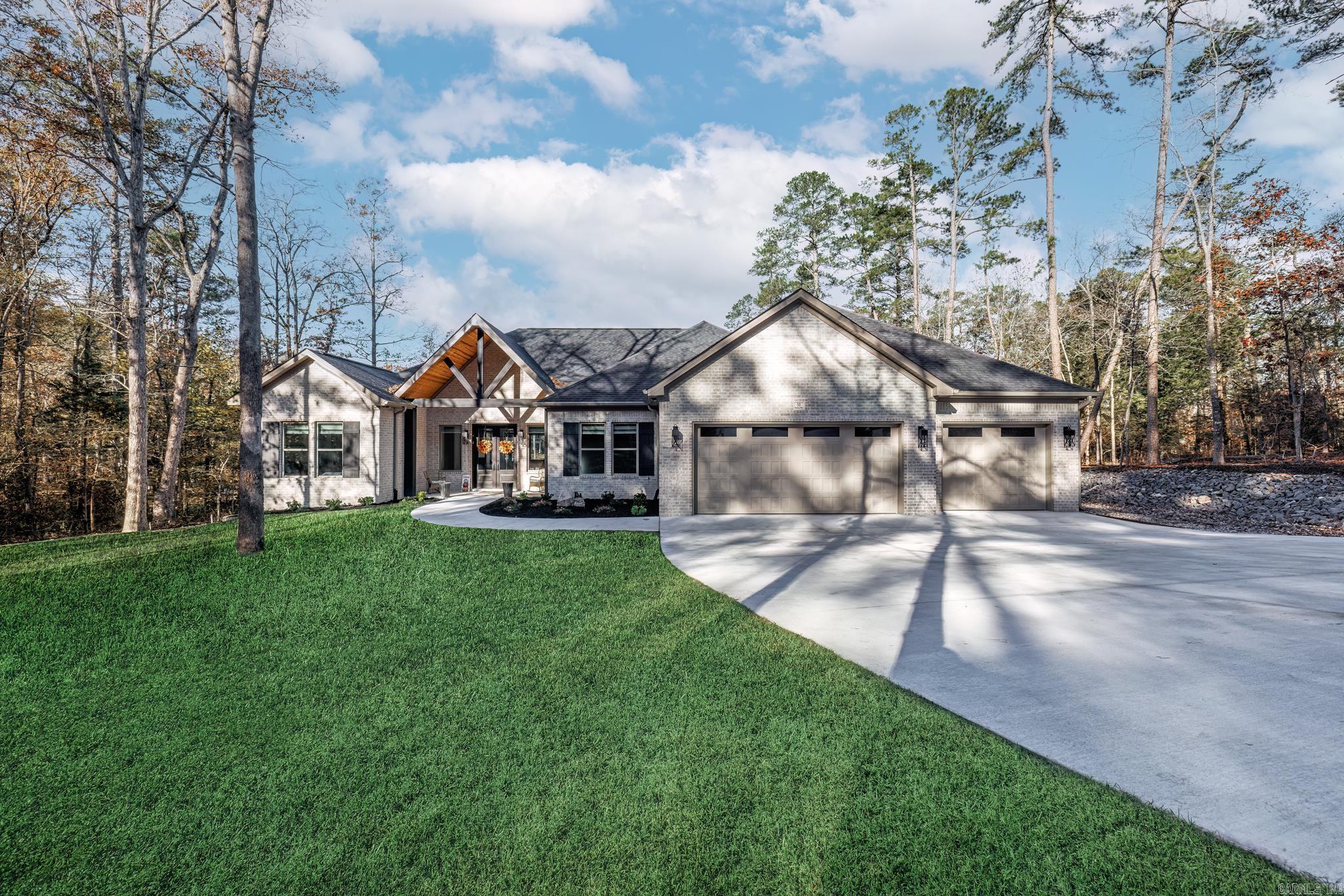 Don't miss your opportunity to have a newly built home that has barely been lived in. Beautiful custom built home on Lake Balboa with a picture perfect view of water from the moment you drive up. Stunning views greet you the moment you open the door taking in the walls of windows. Entertaining in this home is a breeze both inside and outside. Massive island in the kitchen allows you to flow from one area to the next. 10' ceilings and 8' doors thru out the home including a beamed and vaulted ceiling in the great room. Feature wall in the primary bedroom with concrete safe room. Divided bedrooms provide privacy desired. Office can be fourth bedroom or exercise area. Covered patio with wood burning fireplace for cool morning coffee or evening sunsets. Lake living enjoyed on lakeside patio or 97' of sea wall with a covered boat dock with lift. Stairs to lake give you easy access for swimming or kayaking. All the work is done - just come and enjoy life in Hot Springs Village! Features list in documents.  AGENT REMARKS