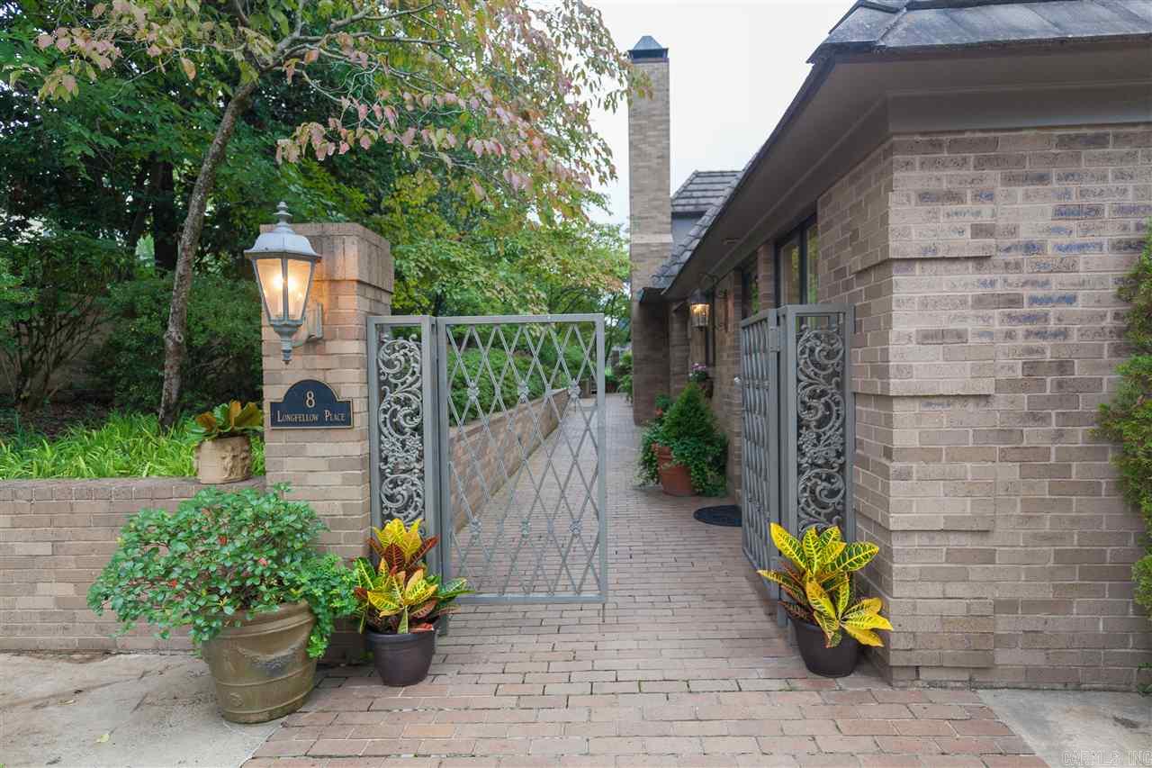 Exceptional French style home on private setting.  Spacious rooms with wide 8' doorways, 10' ceilings offer open living areas. Glass doors to walled courtyard with 40' lap pool.  Cozy den, master bedroom down, 2 bedrooms & 2 baths up + office & cedar storage room.  Two fireplaces, two offices, concrete tile roof, 3 HVAC, 3 HWH, generator, heated floor in master bath.  Also a 2 car garage! Mint condition & quality custom built!