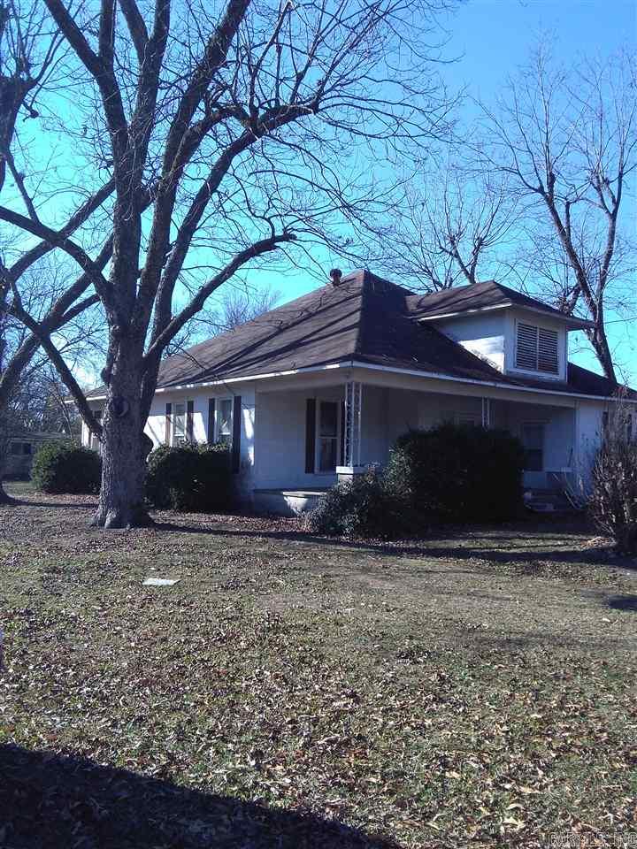 Call today and let's take a look at this wonderful older home with tons of character. Sitting on approximately a half of an acre in town, this place has unlimited possibilities.  The large pecan trees shading this home with large rooms set the atmosphere for its time period.  This one is priced to SELL!!!