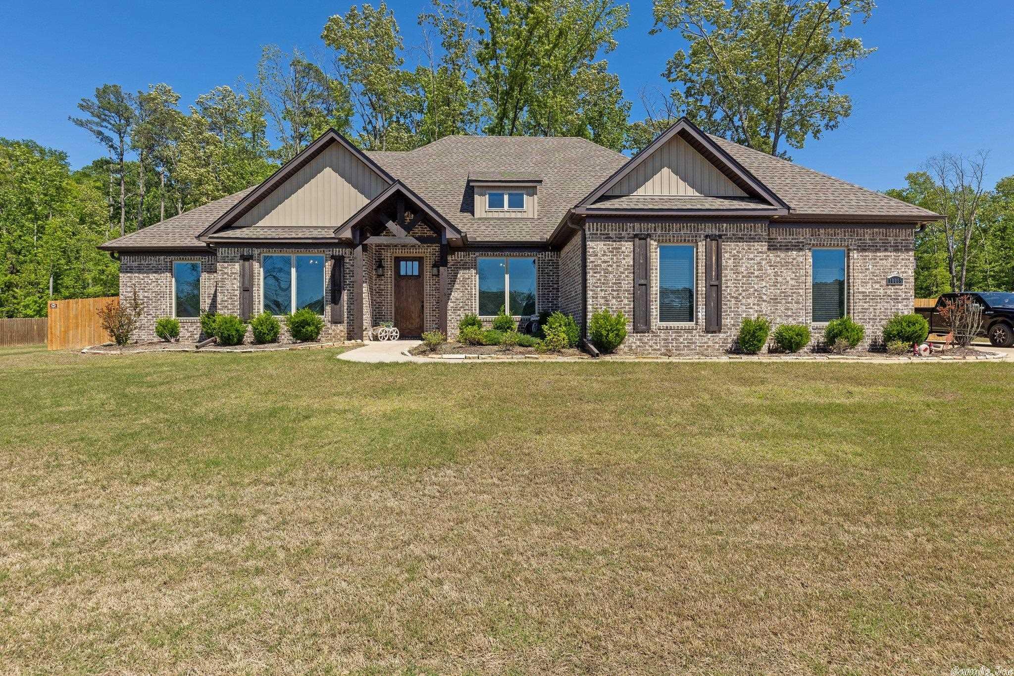 Welcome to this charming, custom built home in a beautiful neighborhood. This newer home has a great layout with four bedrooms, 2.5 bathrooms, and an office that could be designated as a 5th bedroom if needed. The kitchen is a chef's dream with a smart oven, beautiful island, and walk-in pantry. Adding to the modern home's charm are beautiful wood floors, granite countertops, shiplap accents, and a mudroom. Sitting on over an acre, the exterior features of this home are perfect for entertaining, with a large covered patio, outdoor fireplace, and large circle drive with plenty of parking. Schedule your tour today!