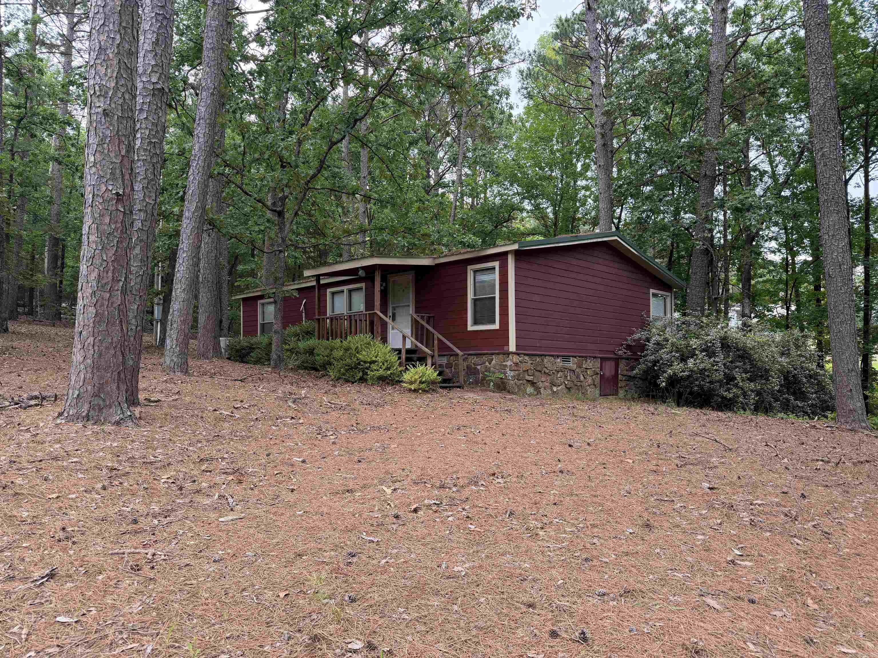 Nestled on 3 acres just minutes from Devil’s Fork Recreation Area, this 3-bedroom, 2-bath home offers the perfect blend of comfort, privacy, and convenience. Surrounded by mature trees providing plenty of shade, the property creates a peaceful country setting ideal for relaxing or entertaining. Enjoy spacious living areas, a functional floor plan, and room to roam both inside and out. Whether you’re looking for a full-time residence, weekend getaway, or investment opportunity near the lake, this property is a must-see! Property is being sold "As Is, Where Is".
