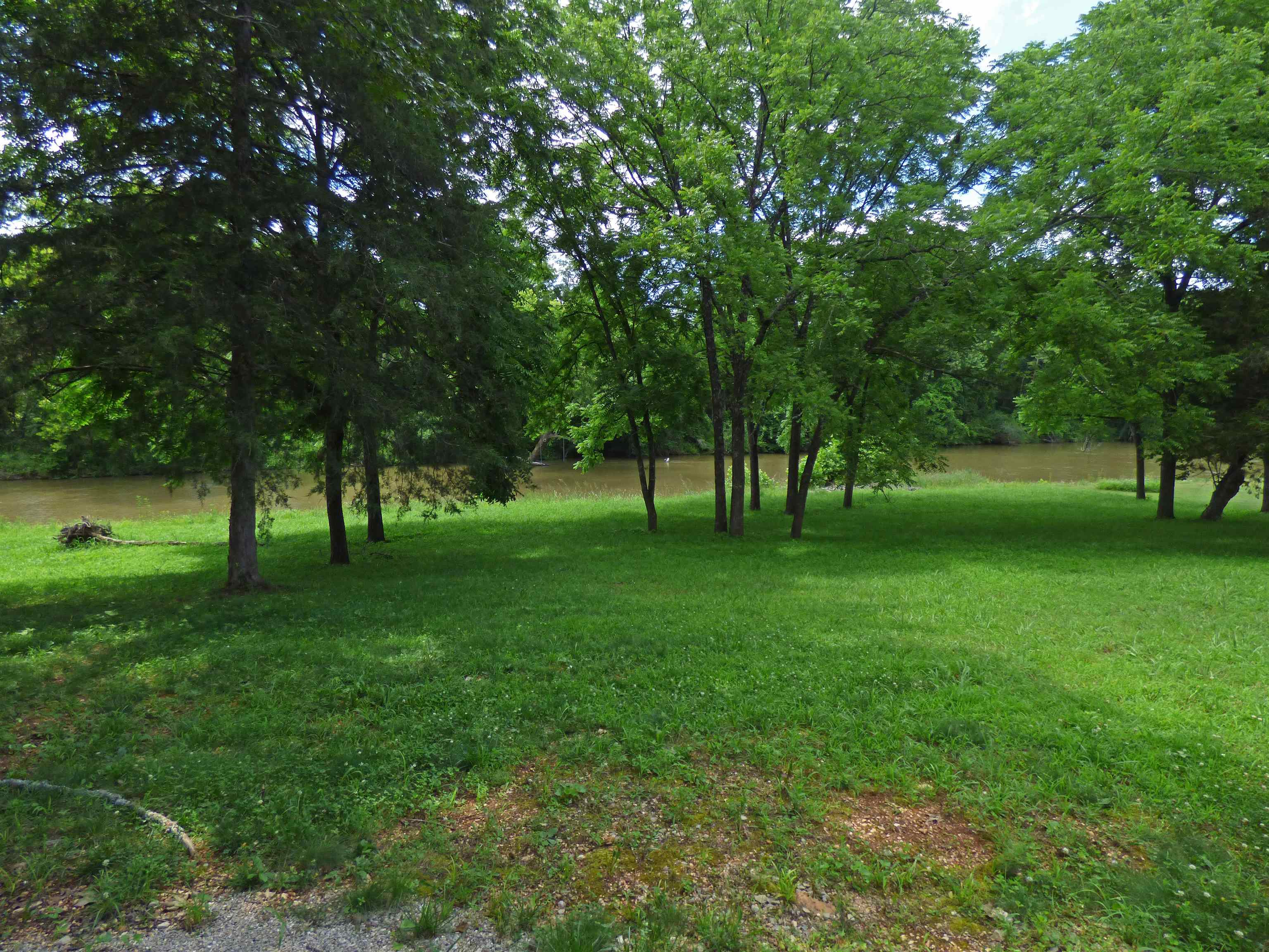 Beautiful South Fork River Lot with Camper - This river lot sits right on the South Fork River with over 100 ft. of river frontage. There are some trees that provide shade. The Aspen Trail Camper is included and has a bedroom, bath, kitchen and fireplace. Has its own septic and well. Also has a storage building for you to store your river toys. This is a perfect get-away spot to enjoy the peacefulness of The South Fork River whether you want to swim, fish, float, wade or lounge nearby.
