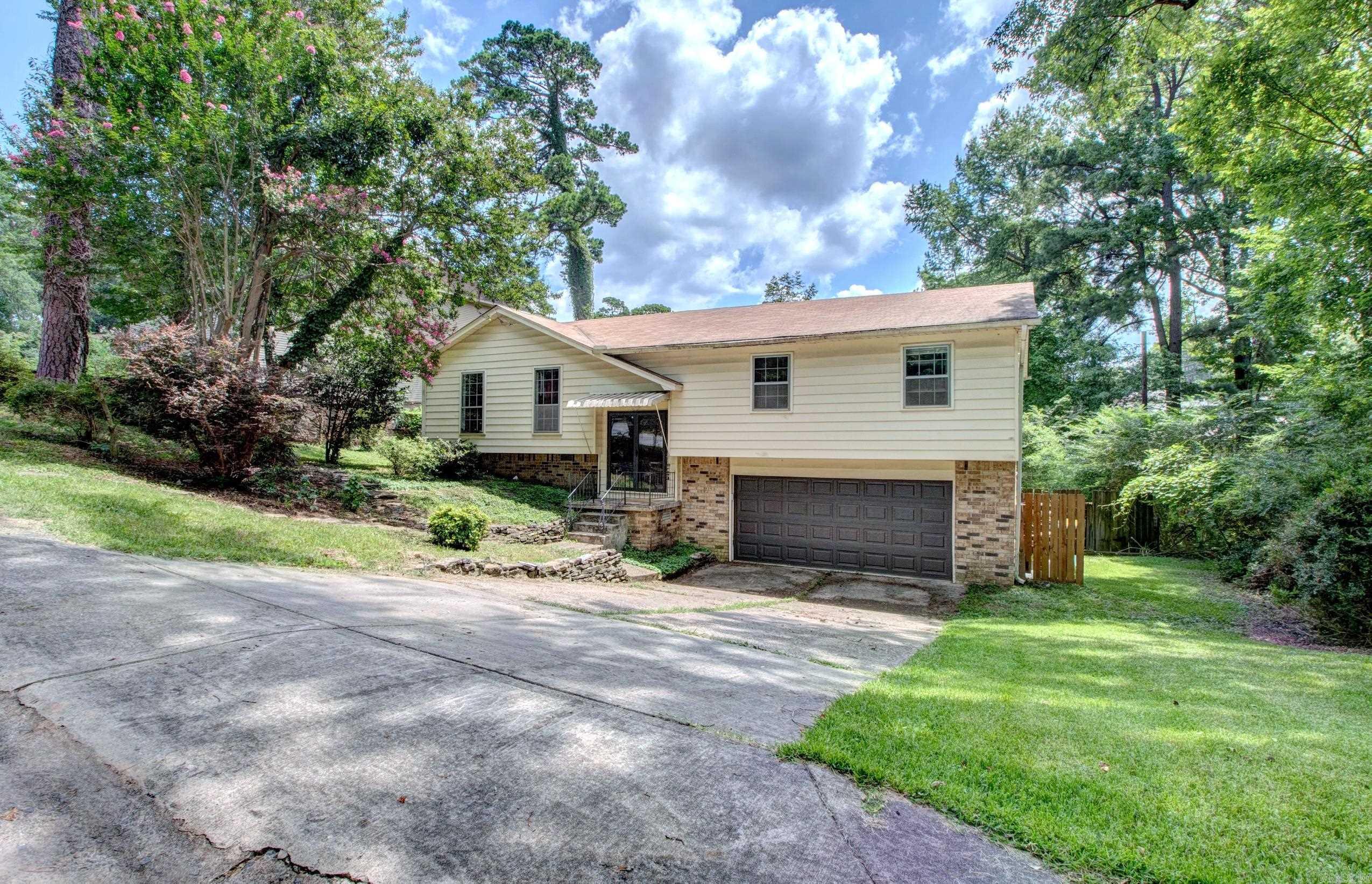 Welcome to this charming, artsy and eclectic decorated home featuring mature landscaping and beautiful lake view. Take in the scenery and enjoy the outdoors from the large deck overlooking the lawn.   Inside you’ll find 3 bedrooms and 2 full bathrooms, including a spacious living room with beautiful hardwood floor and lots of windows.  The bright eat-in kitchen offers comfortable space for cooking and everyday living. Large laundry room.  Washer and Dryer convey.   Additional highlights include: 2 Car Garage with New garage door.  Refrigerator stays with the home.   Take a tour today!  Agents: Please See Remarks