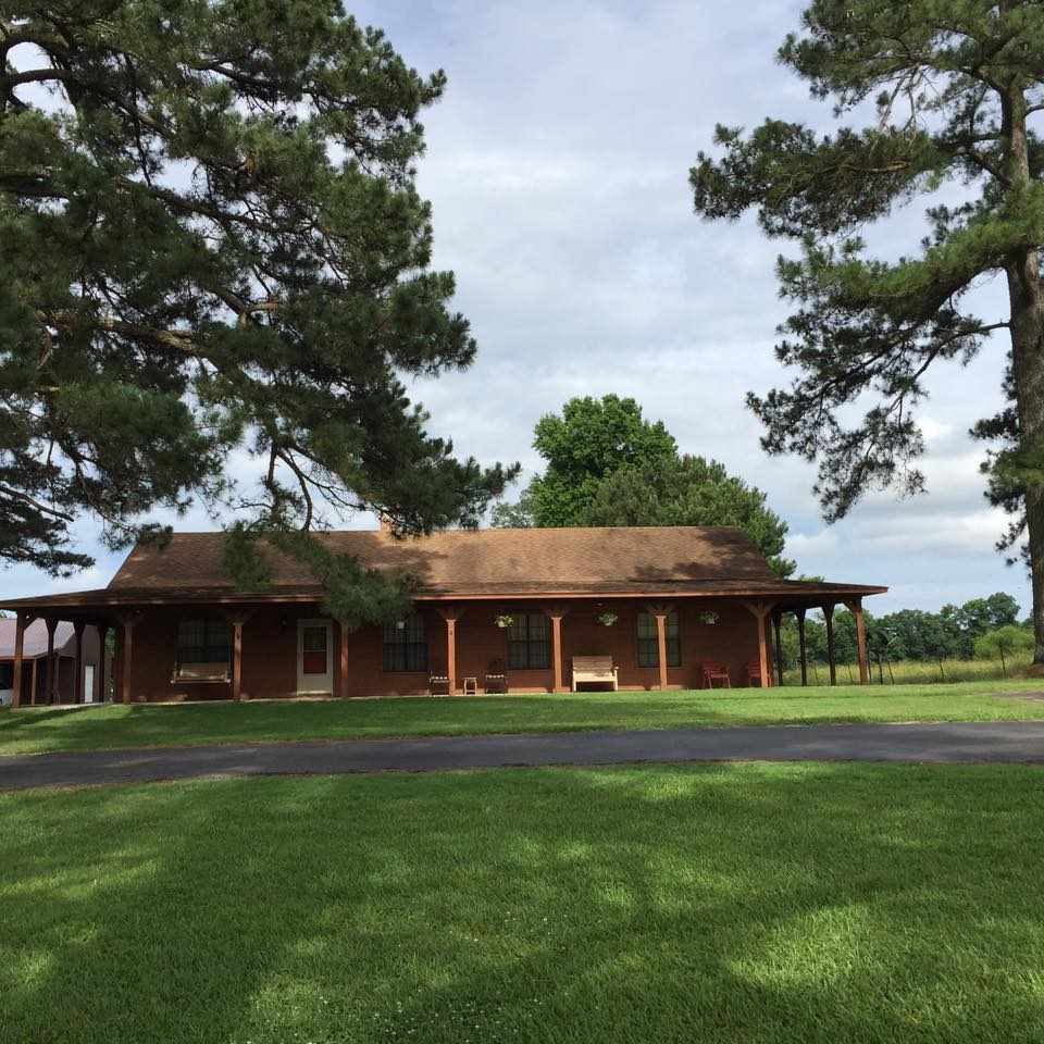Country property with 27 acres and a brick home, offers 3 bedrooms and 2 full baths.  Fireplace, open living space, covered surround porch, shop building and small entertaining patio with enclosed space.  Fenced and crossed fenced and pond.