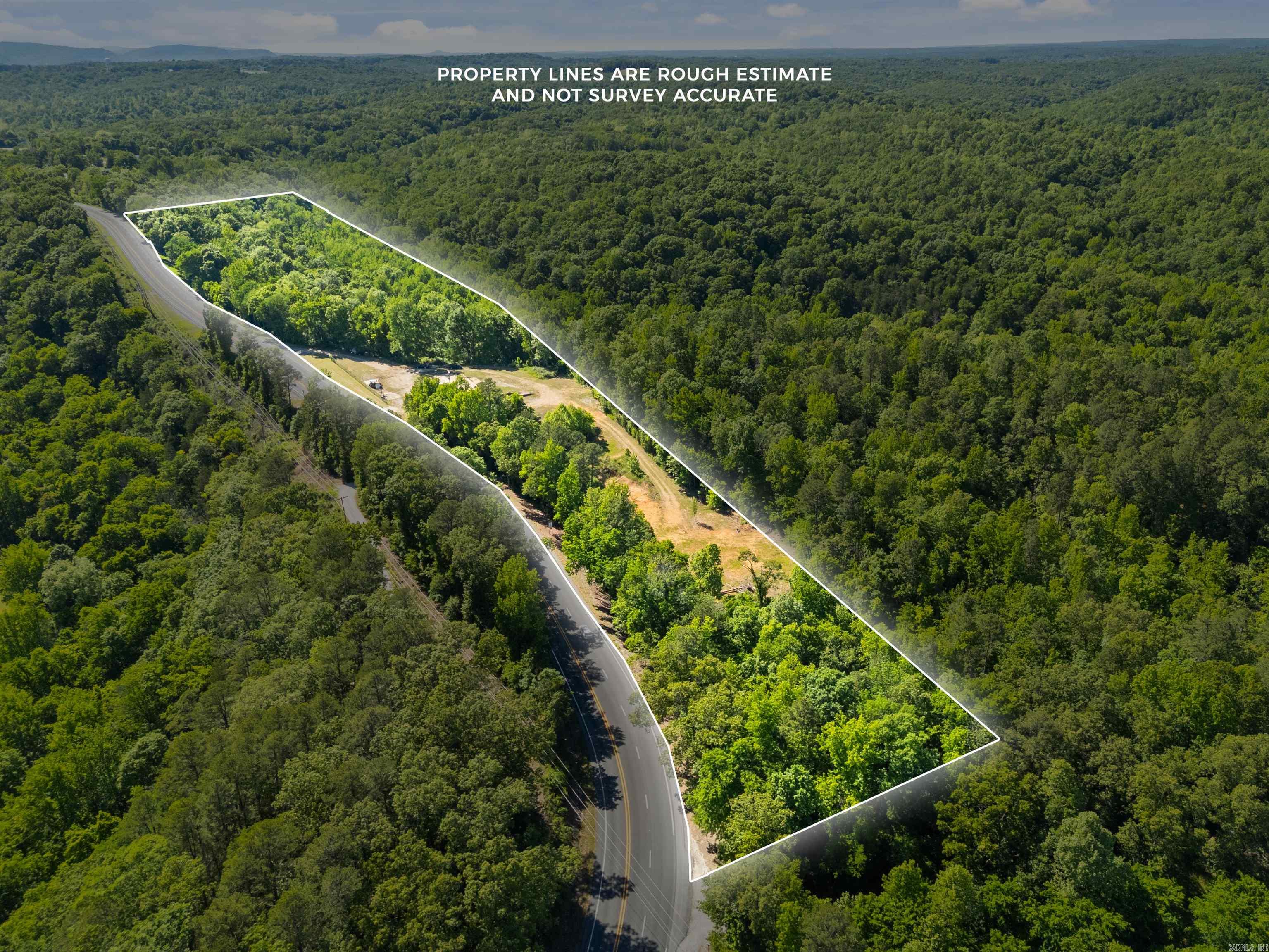 Rare opportunity just outside of Mountain View! This 22 acre ml property offers endless potential with approximately 1 acre zoned commercial with high visibility and highway frontage, offering excellent potential for business development or housing. The remaining acreage providing privacy, room to build, recreation or investment opportunities. Convenient location with highway access, beautiful natural surroundings, and plenty of space to make your vision a reality.  Properties with this kind of flexibility don't come around often!