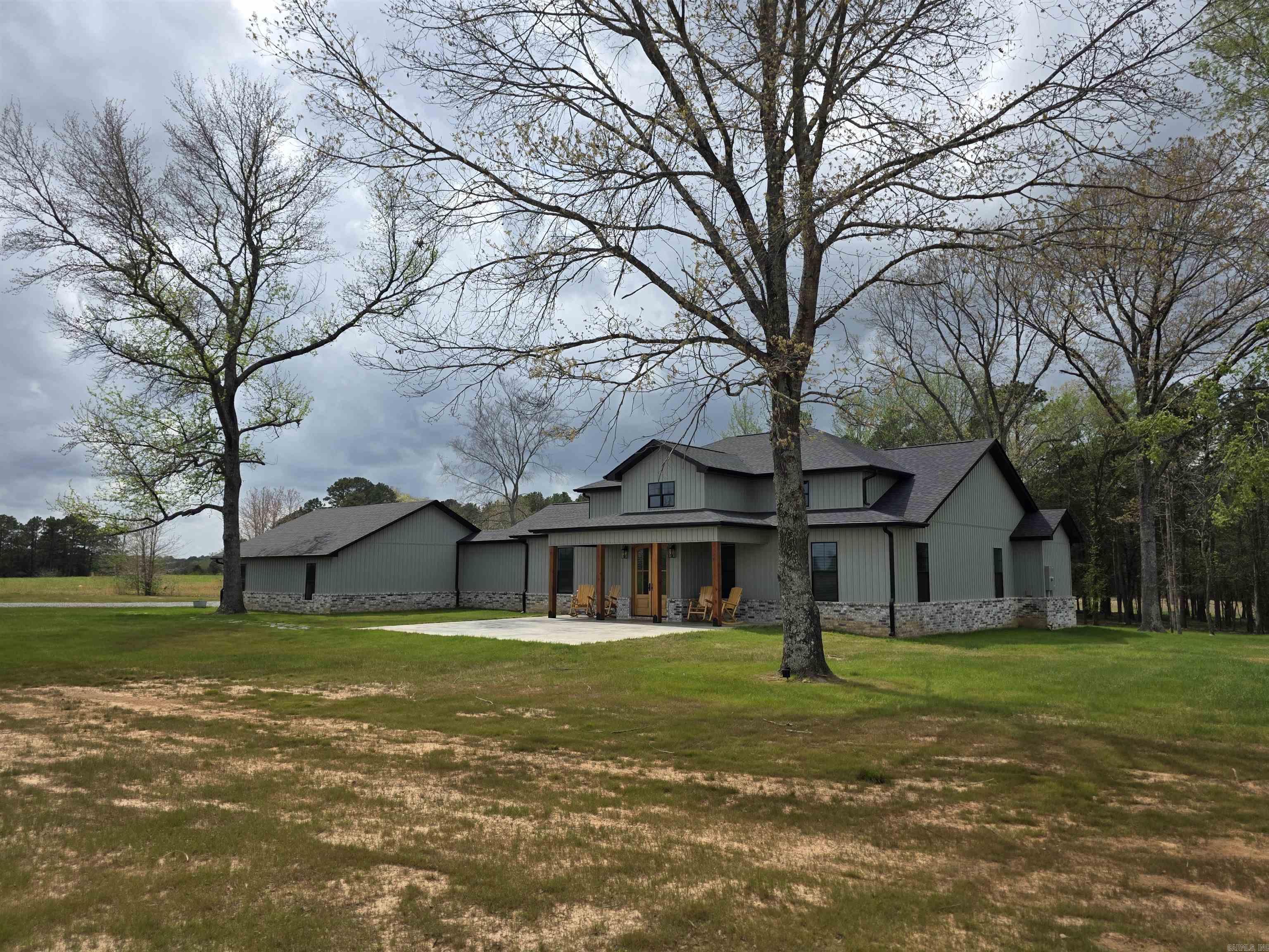 Exceptional floor plan with this one level, 4 bed 2.5 bath house on 3.27 acres just outside of Quitman. Enjoy the country feel with amazing vista views, gorgeous sunsets, and the 20 acre stocked private lake for Bettis Mountain Residents. Also just 12 mins (7.4 miles) to Cove Creek Recreation Area to launch a boat on Greers Ferry Lake. Just completed in Dec. 2025. The 100amp service shop is 30x30 with a 10ft lean to and overhead doors that have electric openers. Dream kitchen with Forno appliances and built-in refrigerator. Pass through window in kitchen to the amazing, covered patio/deck. Custom cabinets with under cabinet lighting. Hidden walk-in pantry. Quartz countertops throughout home with undermount sinks. All Bedrooms have walk in closets with primary closet having a custom built in dresser. Safe room inside the home. Living room offers a propane gas vent free fireplace with wall thermostat and built-ins around fireplace. The list could go on forever. This is a must see in person and will not disappoint! Agents, please see remarks.