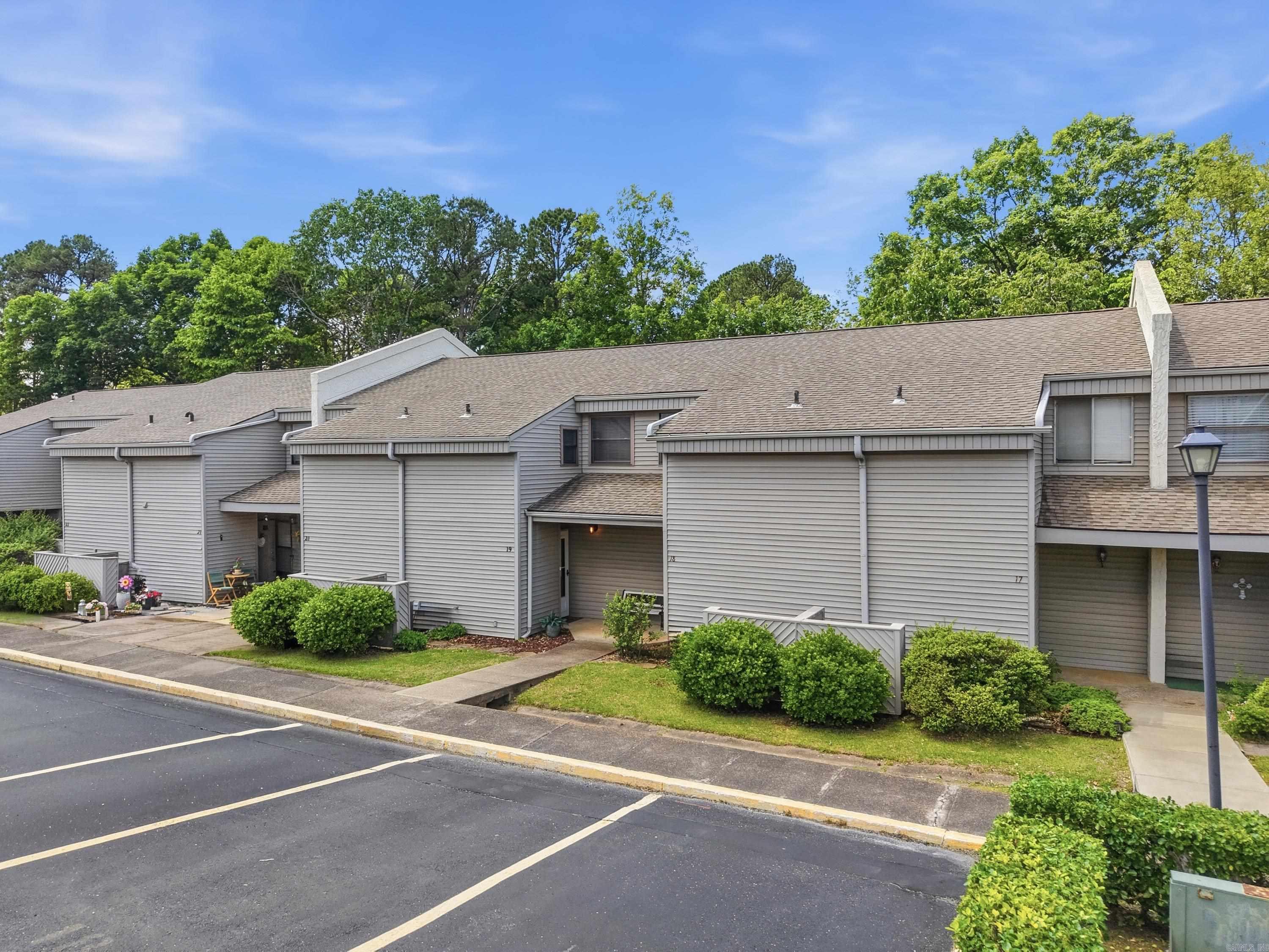Beautifully updated and fully furnished 2BR/1.5BA Lakewood Hills condo in the heart of Fairfield Bay! This move-in-ready two-level condo offers stylish updates, comfortable living, and a fantastic location near all the area amenities. The open-concept living, dining, and kitchen areas create a warm and inviting space perfect for entertaining or relaxing. The remodeled kitchen features oak cabinetry, updated countertops, wainscoting, and quality appliances. Both bathrooms have been tastefully renovated, including a walk-in shower in the full bath. One bedroom includes a built-in office/TV nook with desk and cabinetry, while the spacious primary bedroom offers built-in drawers and an ironing board for added convenience and storage. Updated vinyl plank flooring, carpet, doors, windows, and light fixtures add to the fresh modern feel throughout. Step outside to a private patio overlooking a peaceful wooded setting, or enjoy the nearby private association pool. Conveniently located near shopping, restaurants, banks, pickleball, tennis, ATV/UTV trails, and only 10 minutes from Greers Ferry Lake. This one is ready to enjoy from day one!