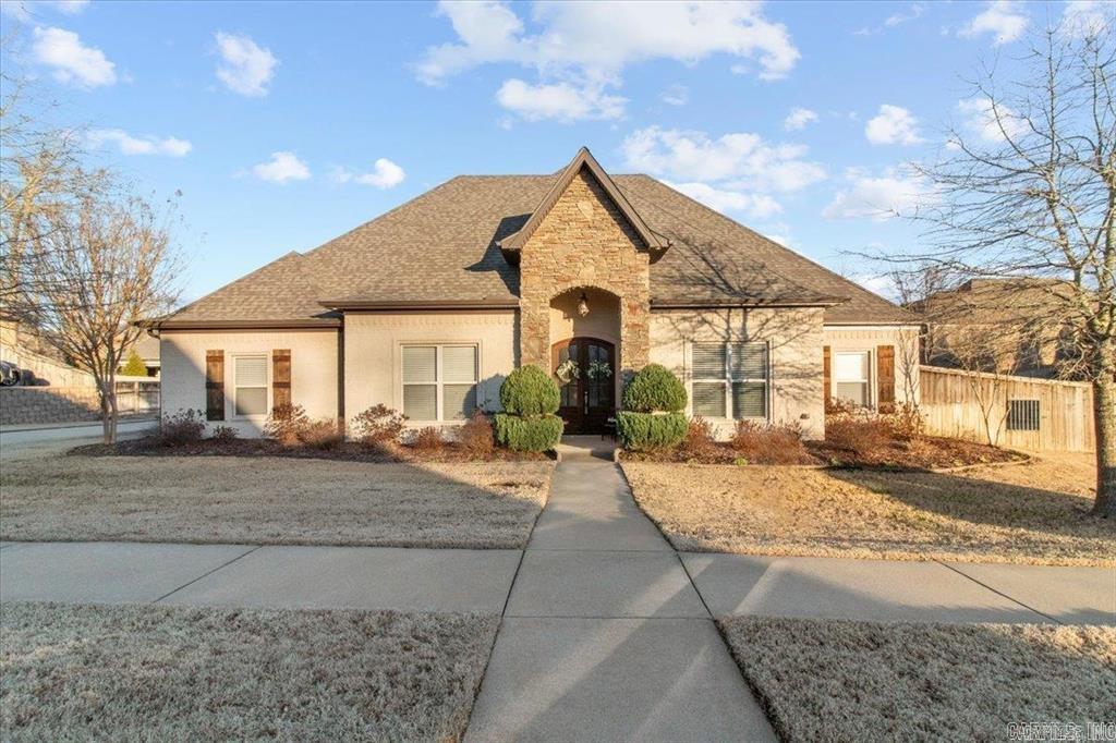 Welcome to this beautifully maintained 4-bedroom, 2.5-bath home offering approximately 3,150 square feet of comfortable living space in a well-established neighborhood. From the moment you step inside, you'll appreciate the hand-scraped hardwood floors, soaring ceilings with wood beam accents, and a cozy gas log fireplace. The spacious kitchen features granite countertops, a gas range, breakfast bar, large pantry, and plenty of cabinet space, making it perfect for everyday living and entertaining. The primary suite offers a relaxing retreat with a spa-like bath, double vanity, walk-in shower, and oversized walk-in closet. A versatile bonus room provides endless possibilities for a home office, media room, or playroom. Enjoy outdoor living on the covered patio overlooking the fully fenced backyard with a firepit, ideal for gatherings. Additional features include a 3-car side-entry garage, sprinkler system, zoned HVAC, Low-E windows, and ample attic space with potential for expansion. Community amenities include a pool, tennis courts, clubhouse, playground, and picnic area. Professional photos coming this week!