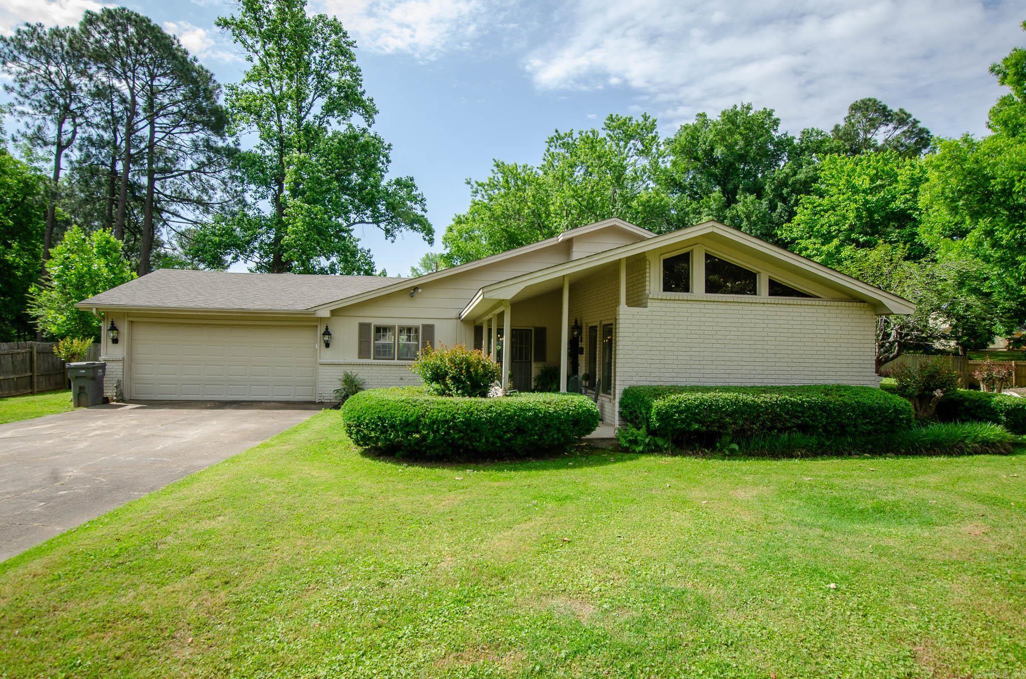 Located in the heart of Jonesboro's highly desirable Melton Addition, this beautiful home offers the perfect blend of comfort and convenience. Nestled among mature trees in one of the city's most established neighborhoods, you'll love being just minutes from schools, shopping, restaurants, and more while still enjoying the peaceful feel of a quiet neighborhood.  Inside, you'll find two living areas (one currently used as a second dining room), three bedrooms, two baths, and open kitchen, and a cozy fireplace in the living room.   Step outside to enjoy the covered front porch, or the fenced backyard with a patio for grilling and storm shelter to keep your family safe.   Recent updates include roof (~2017), sewer lines (~2019), HVAC (~2019), wood-look tile floors (~2022), and kitchen appliances (2022-2024).