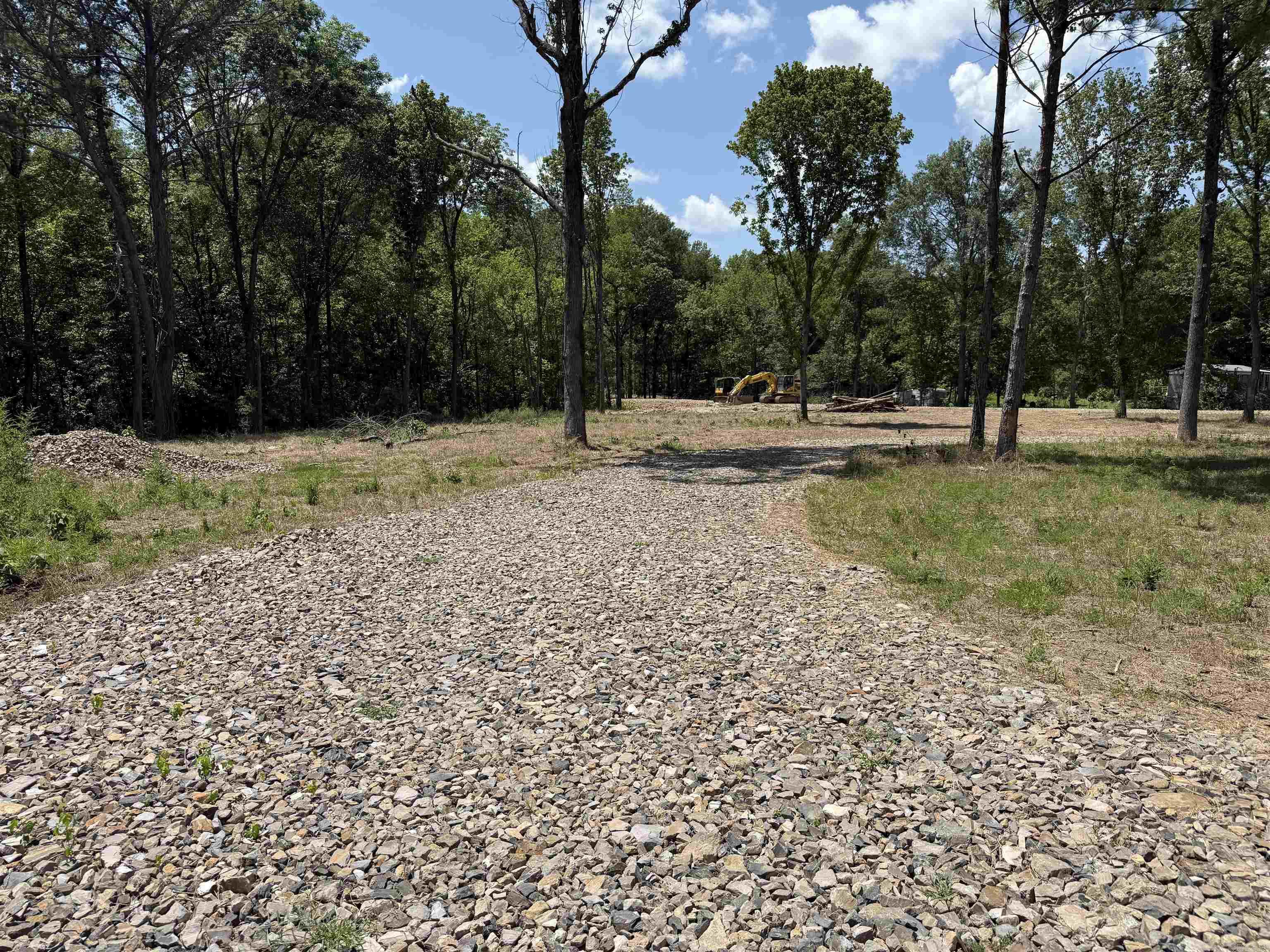 Discover the possibilities with this beautiful unrestricted acreage offering the freedom to build, develop, or invest without the limitations of HOA or restrictive covenants. Whether you're planning a residential subdivision, a private estate, or a mixed-use development, this property provides the flexibility to bring your vision to life. Great visibility with highway frontage. Approximate two acres cleared in the front with a road to back side makes easy access. Back ten acres is wooded  City water, electric, natural gas at the road. Septic or sewer system will need to be installed.