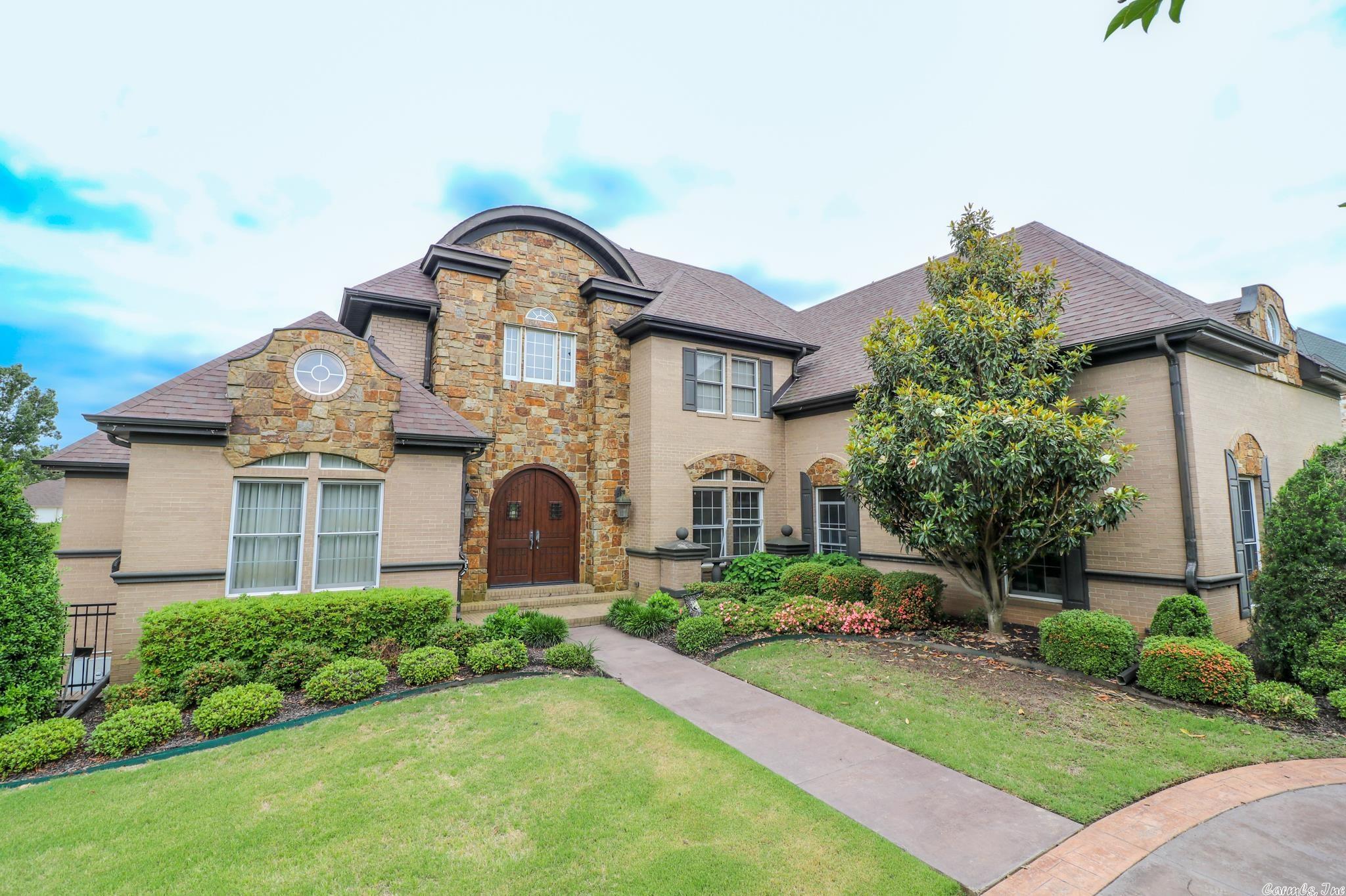 Custom built unique home in prestigious Ridgepointe. 7800 +/- sq feet of amenity after amenity.  5 beds/5.5 baths, formal dining room, den, 2nd living area and a custom built 4 seasons sun room overlooking 7th fairway. This area flows to the kitchen with breakfast bar. Walkout basement, laundry room on each floor, media room, outdoor kitchen that are heated/cooled. Heated pool, hot tub, and basket ball court. Home controlled by smart technology.