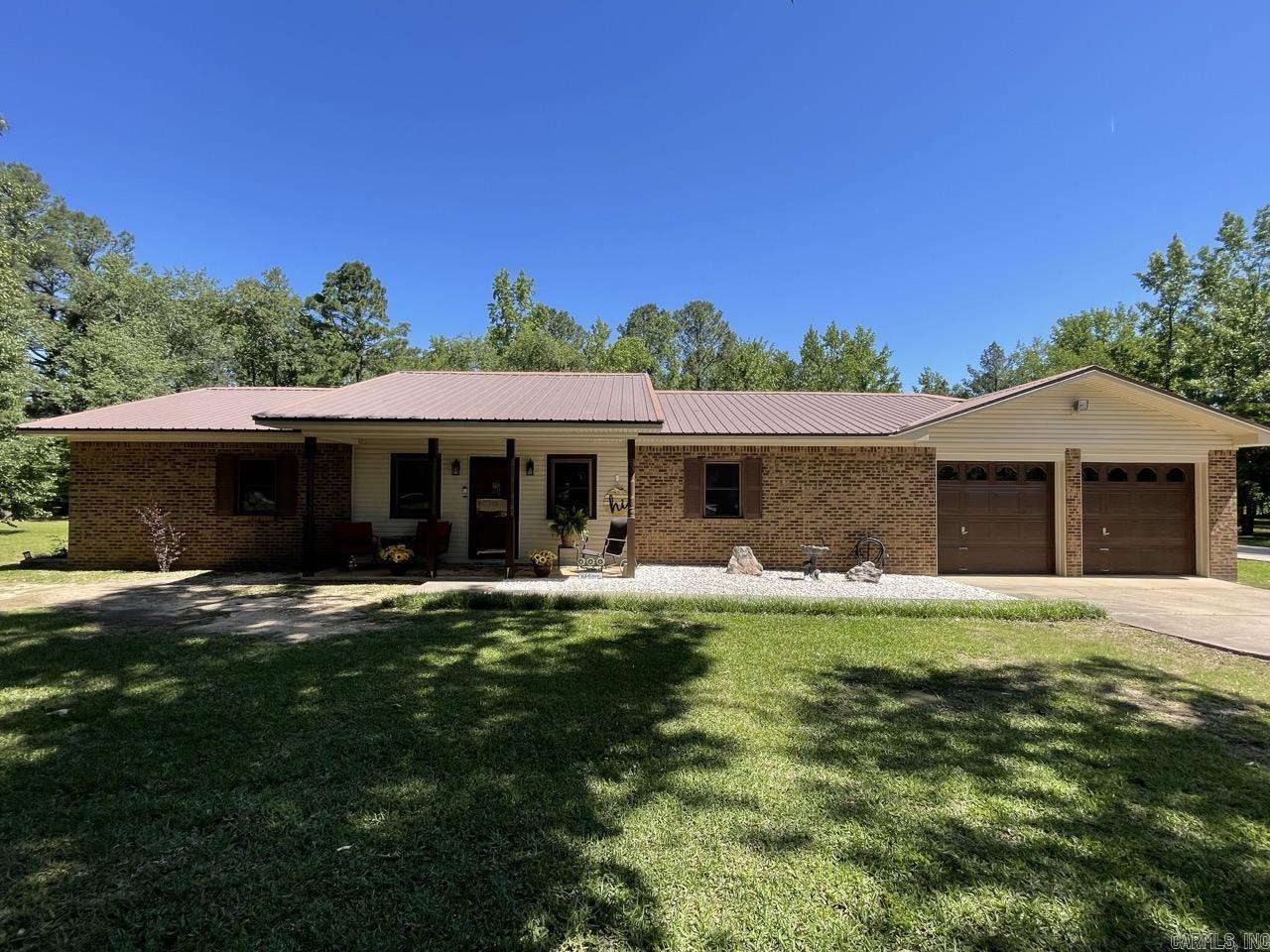 Experience the perfect blend of country and city convenience with this superbly maintained, one-owner estate on 3.48 sprawling acres. This beautiful all-electric home offers a rare sense of privacy where deer are frequent, yet you remain just minutes away from local amenities in Saline County. Built to last with 2x6 construction and featuring solid wood doors throughout, the interior boasts a spacious 4-bedroom, 2-bathroom layout complemented by a large game room or "man cave" perfect for entertaining. The home has been thoughtfully updated over the years, including new countertops and HVAC in 2018, fresh paint in 2022, and upgrades like new windows and insulated siding in 2021 and 2020. The property provides incredible utility and peace of mind with a new septic system installed in 2020 and a roof replaced in 2010. Outdoor enthusiasts and hobbyists will be drawn to the massive 30x40 shop built in 2013, which features two garage doors and ample space for projects, equipment, or vehicle storage. Combining durability, modern updates, and a picturesque acreage setting, this unique property is ready for its next chapter. Schedule your showing today!